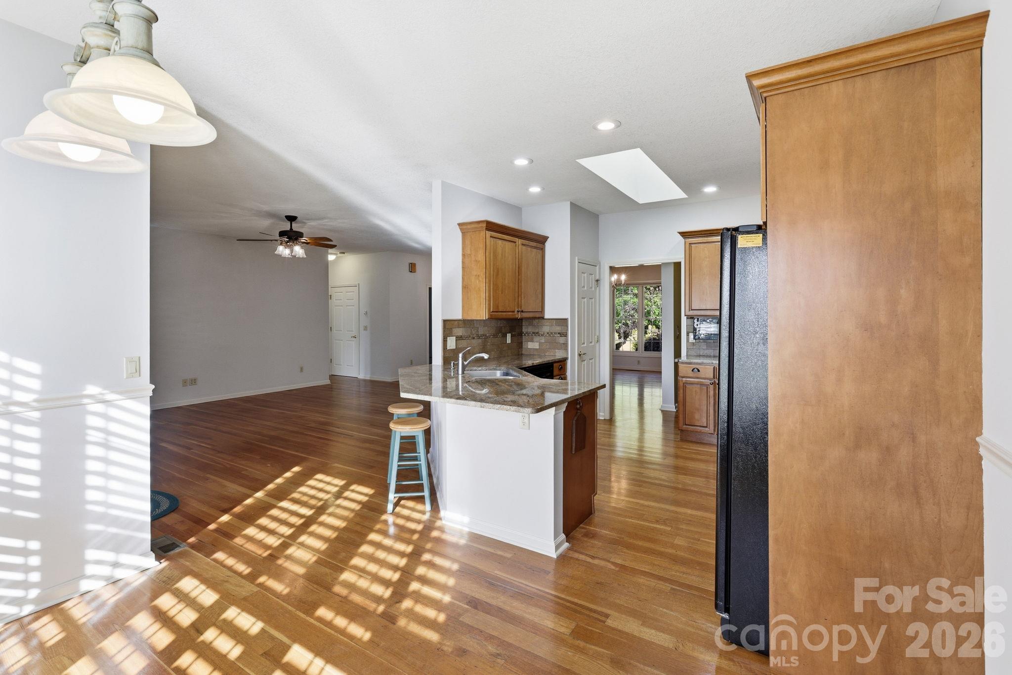 Eat In Kitchen into Living Room and Kitchen - 17 Ashton Forest Court, Hendersonville