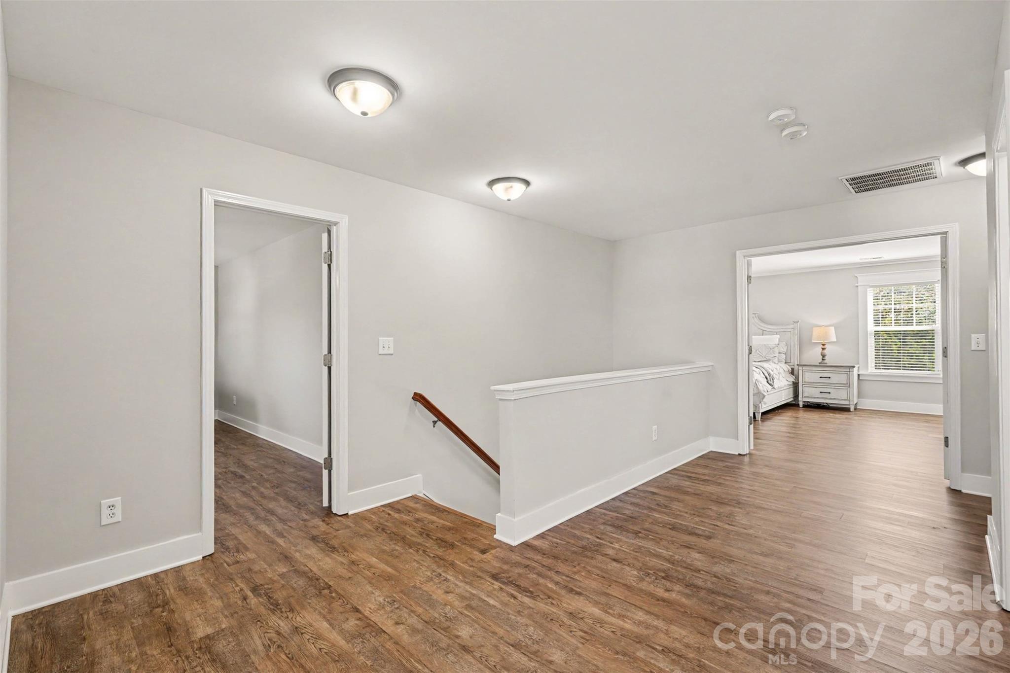 Top of the Landing on the Second Floor looking into the Primary Bedroom Suite... notice NO CARPET and DUAL DOORS for the Primary Bedroom. Super Spacious Second Floor! - 3585 Leighton Drive SW, Concord