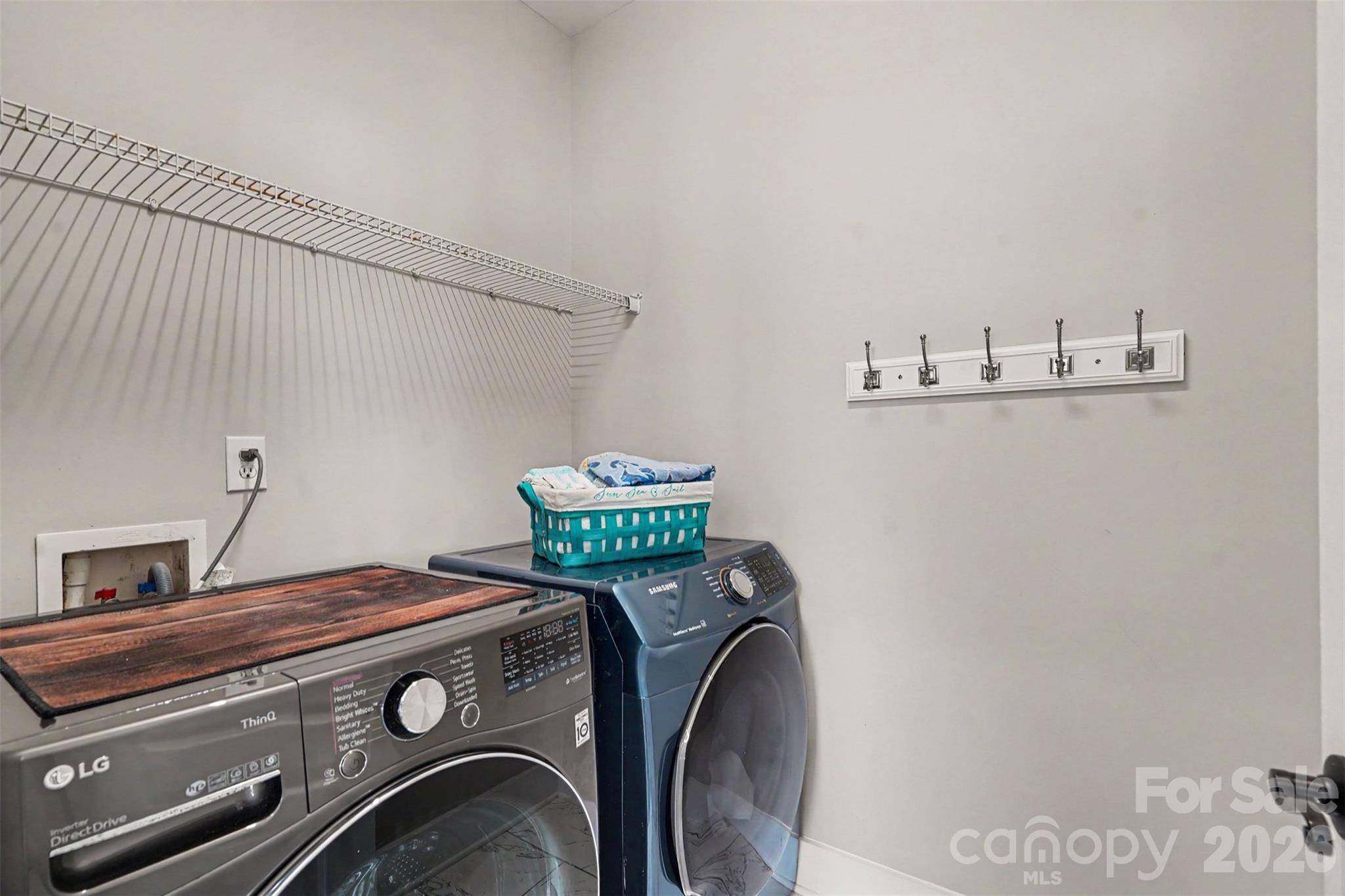 Laundry Room is conveniently located on the main floor! No going up stairs over and over to change out the laundry. - 3585 Leighton Drive SW, Concord