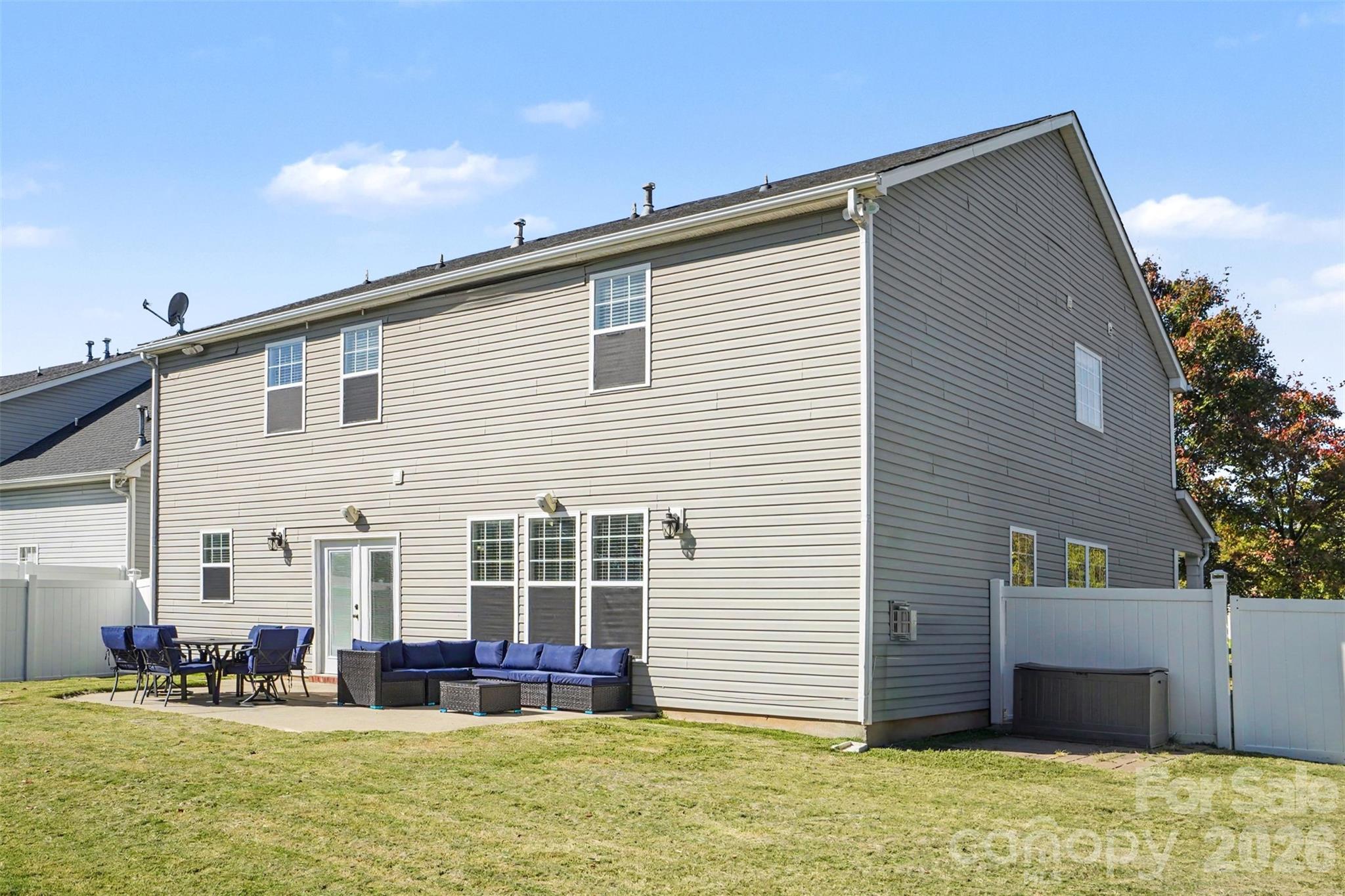 Raar of the home with a spacious patio. Back Yard Featurs a Privacy Fence. - 3585 Leighton Drive SW, Concord