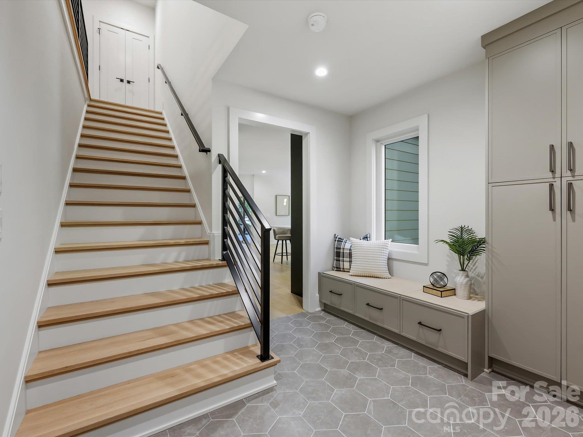 Staircase and mudroom with drop zone - 5401 Lancelot Drive, Charlotte