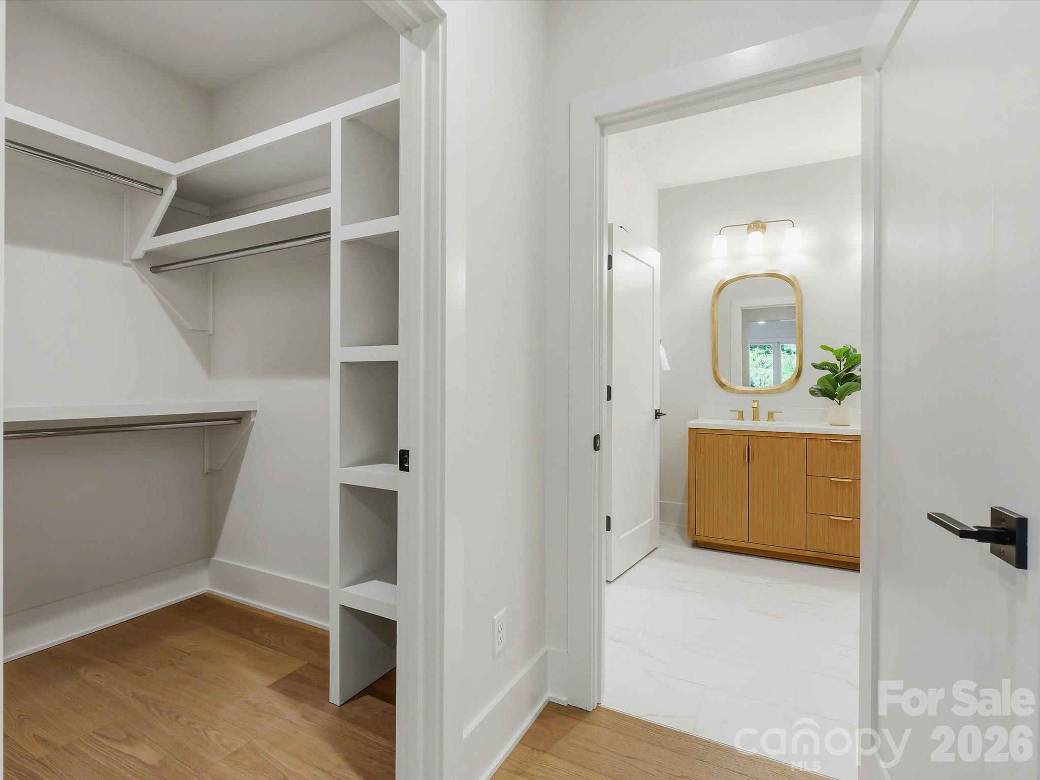 Walk-in closet and en suite bathroom in upper primary - 5401 Lancelot Drive, Charlotte