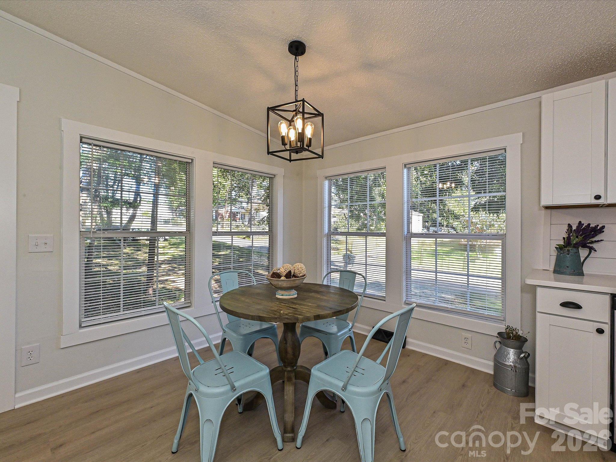 View of breakfast nook. Tons of natural light to enjoy your breakfast and other meals throughout the day. - 1711 Trexlar Avenue, Gastonia