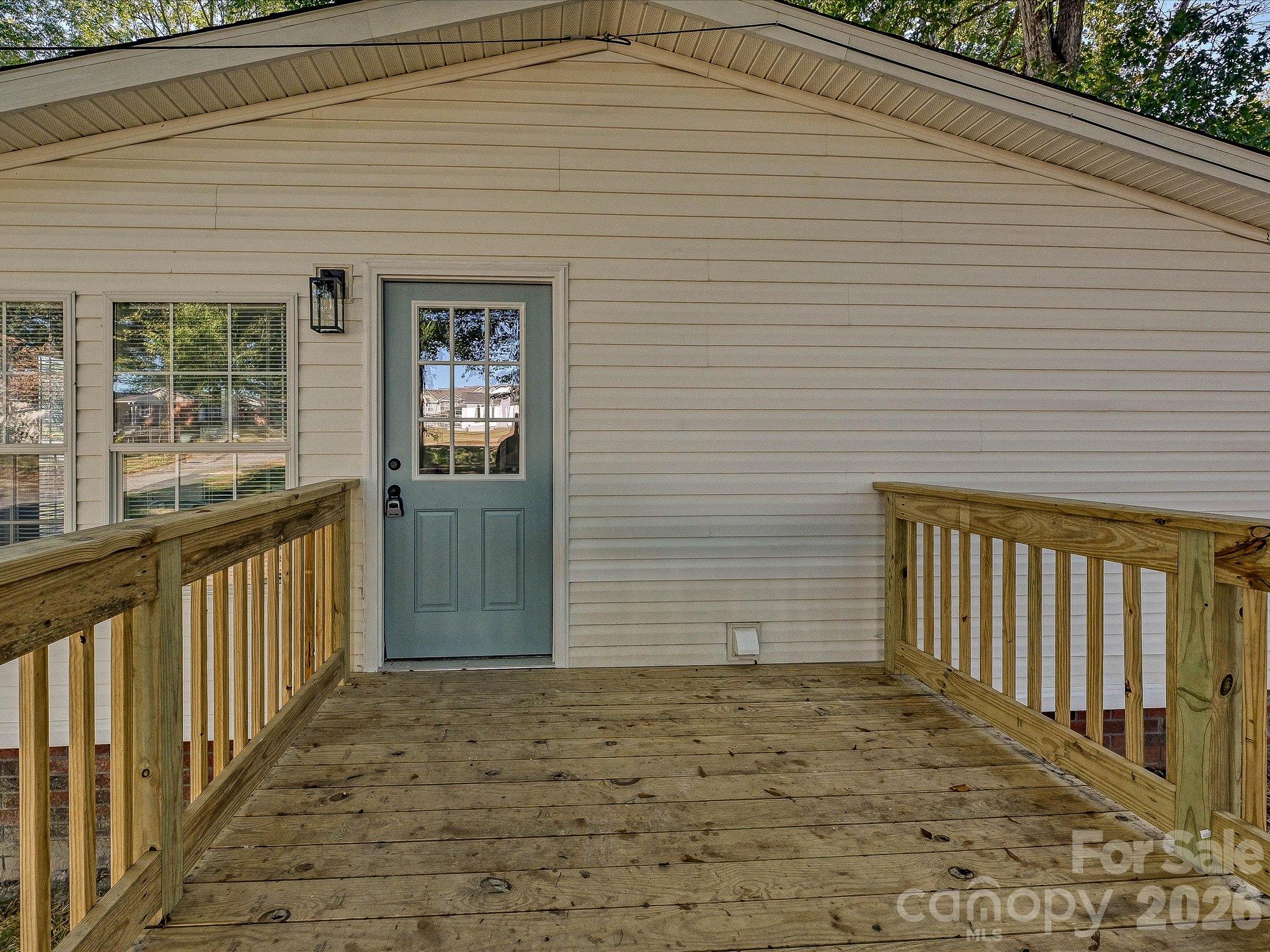 View of new side deck and side entrance into home. Ready for grill, patio furniture and hanging out! - 1711 Trexlar Avenue, Gastonia
