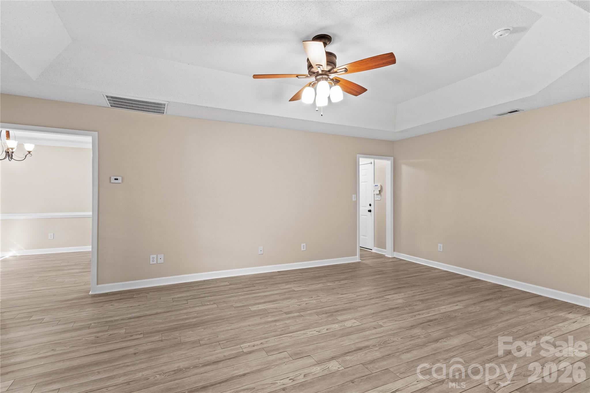 Great room leads to Kitchen and Dining - 117 Abbotswood Place, Mooresville