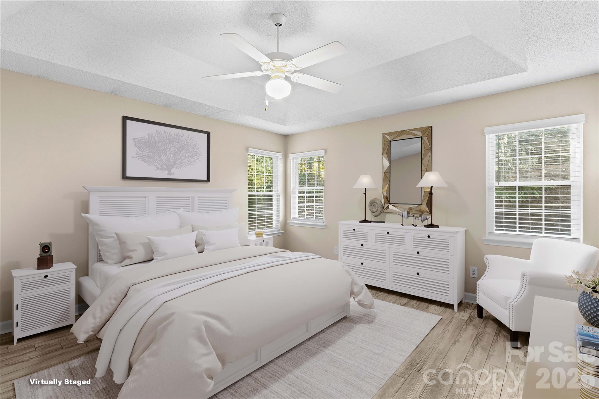 Primary Bedroom with Trey ceiling and Fan - 117 Abbotswood Place, Mooresville