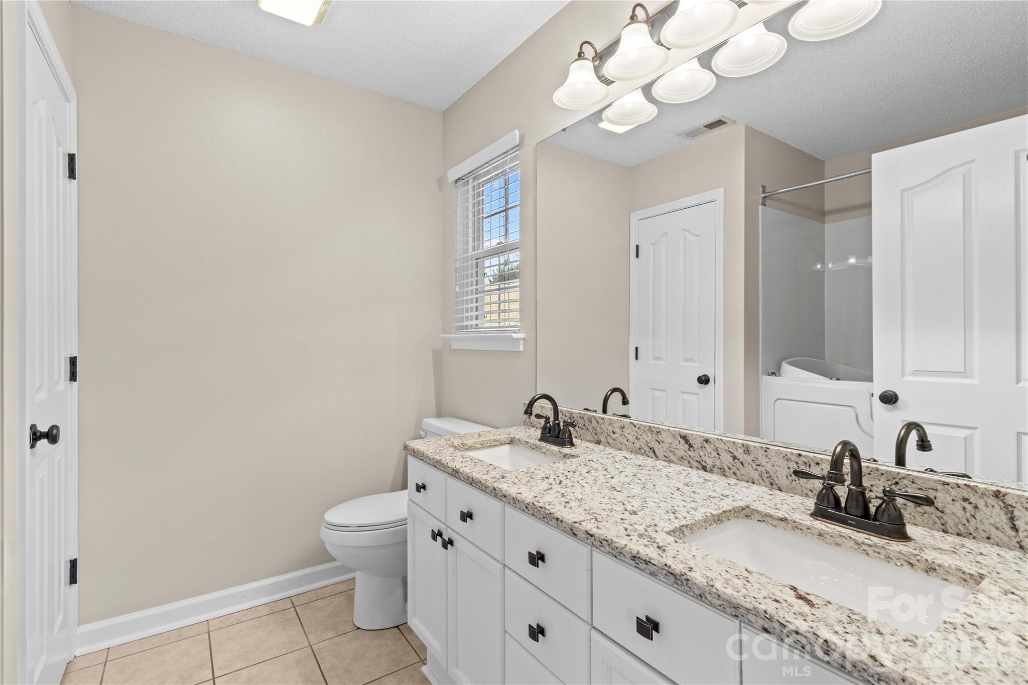 Primary Bathroom with Double Sinks, Granite - 117 Abbotswood Place, Mooresville