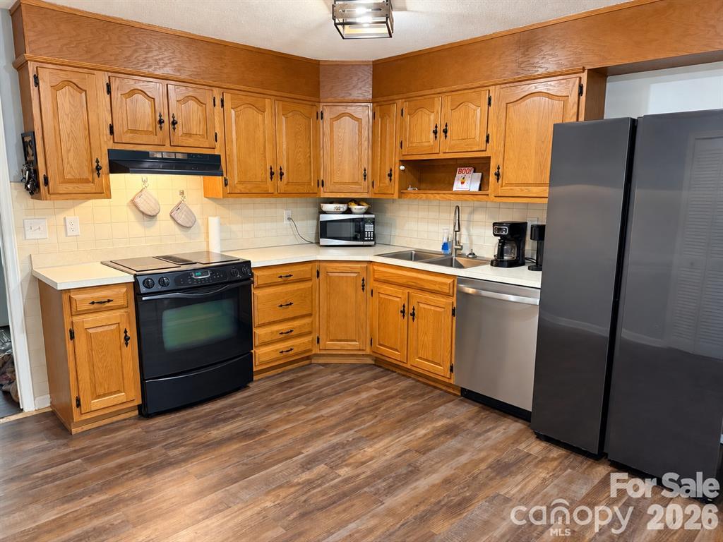 main level kitchen with new floors to match the remainder of the main level - 92 Greenwood Acres Drive, Mills River