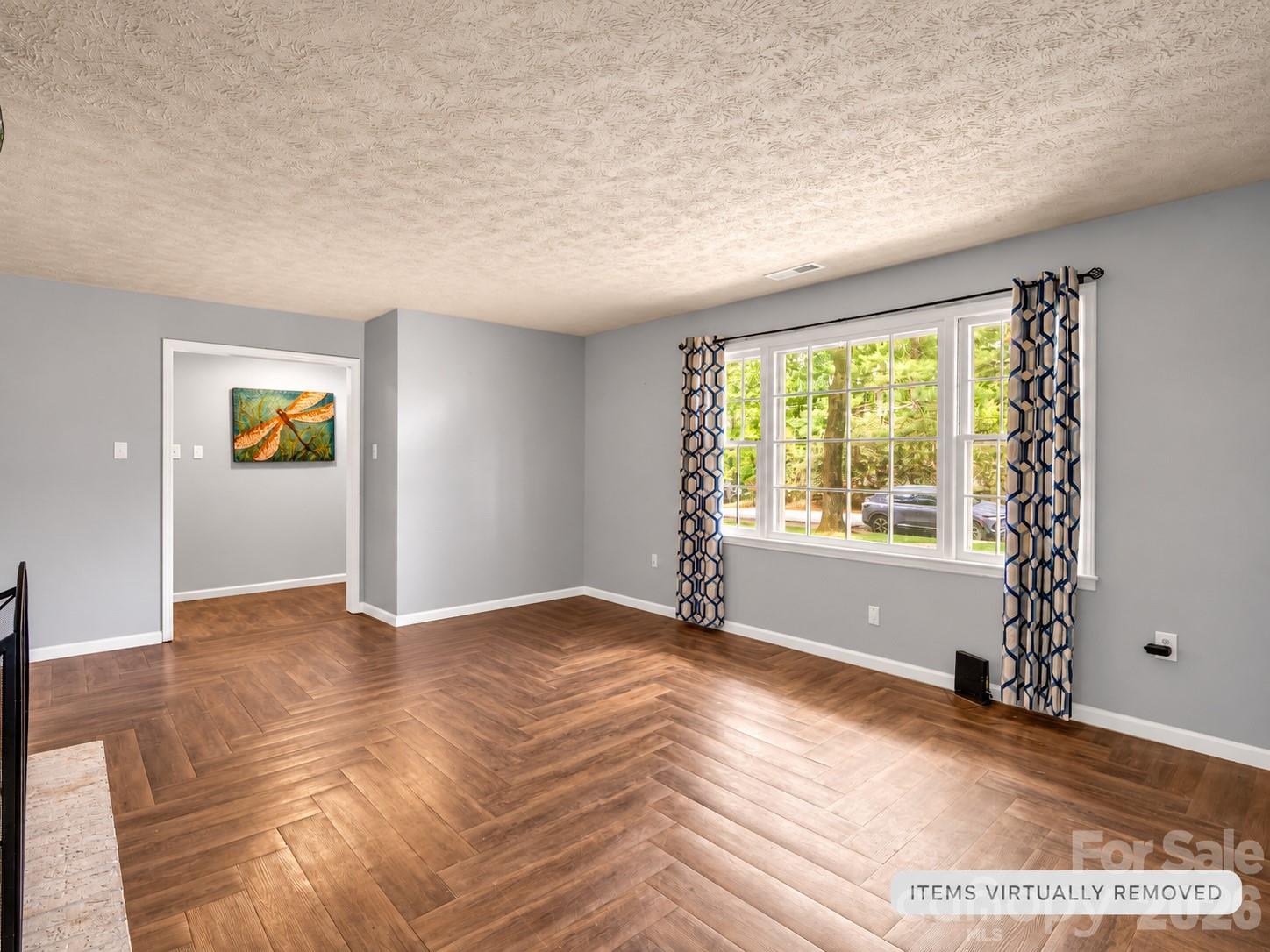 main level living room w/ large window - 92 Greenwood Acres Drive, Mills River