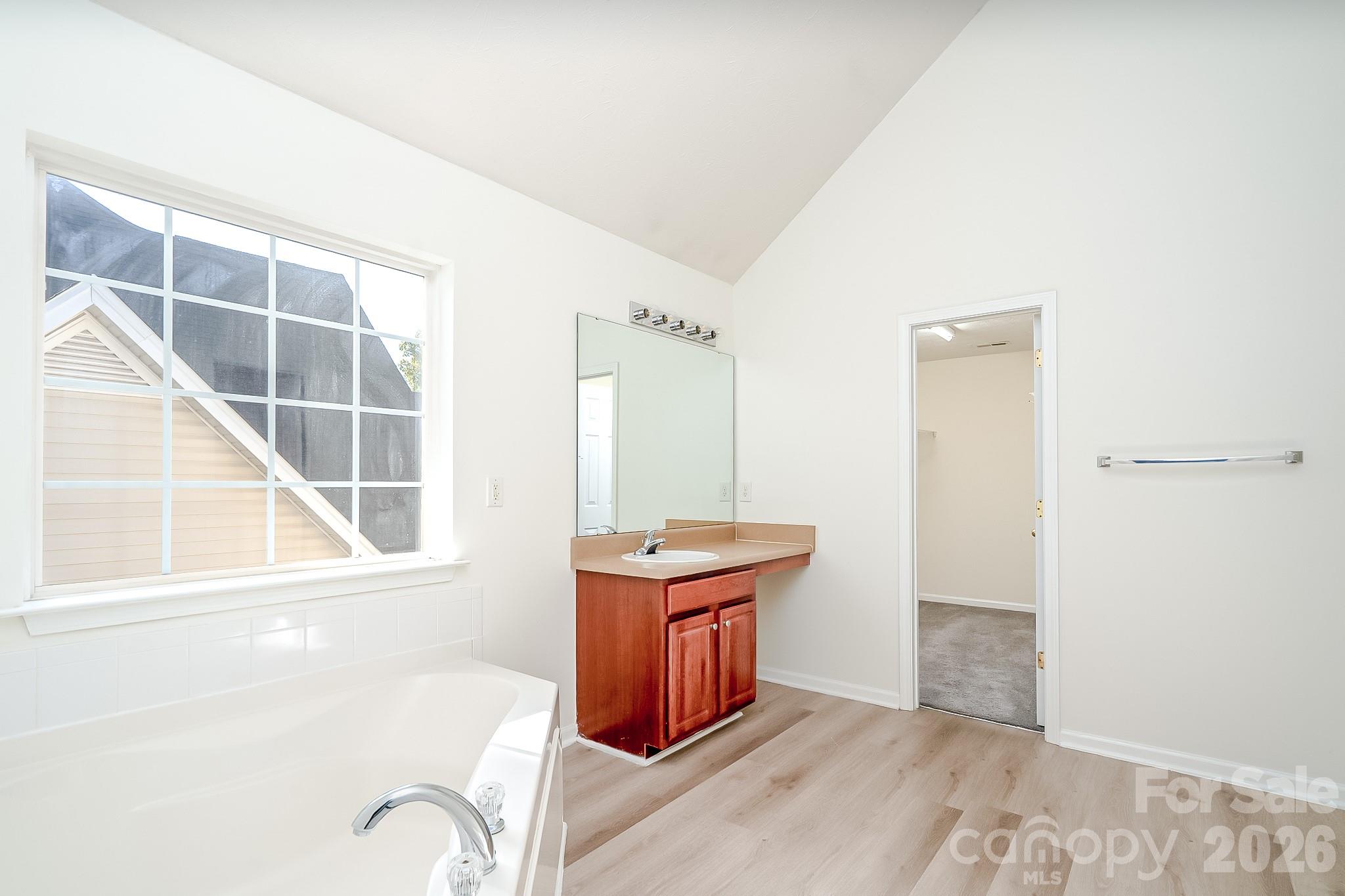 Primary bathroom with garden tub and separate shower - 5124 Eagle Creek Drive, Charlotte
