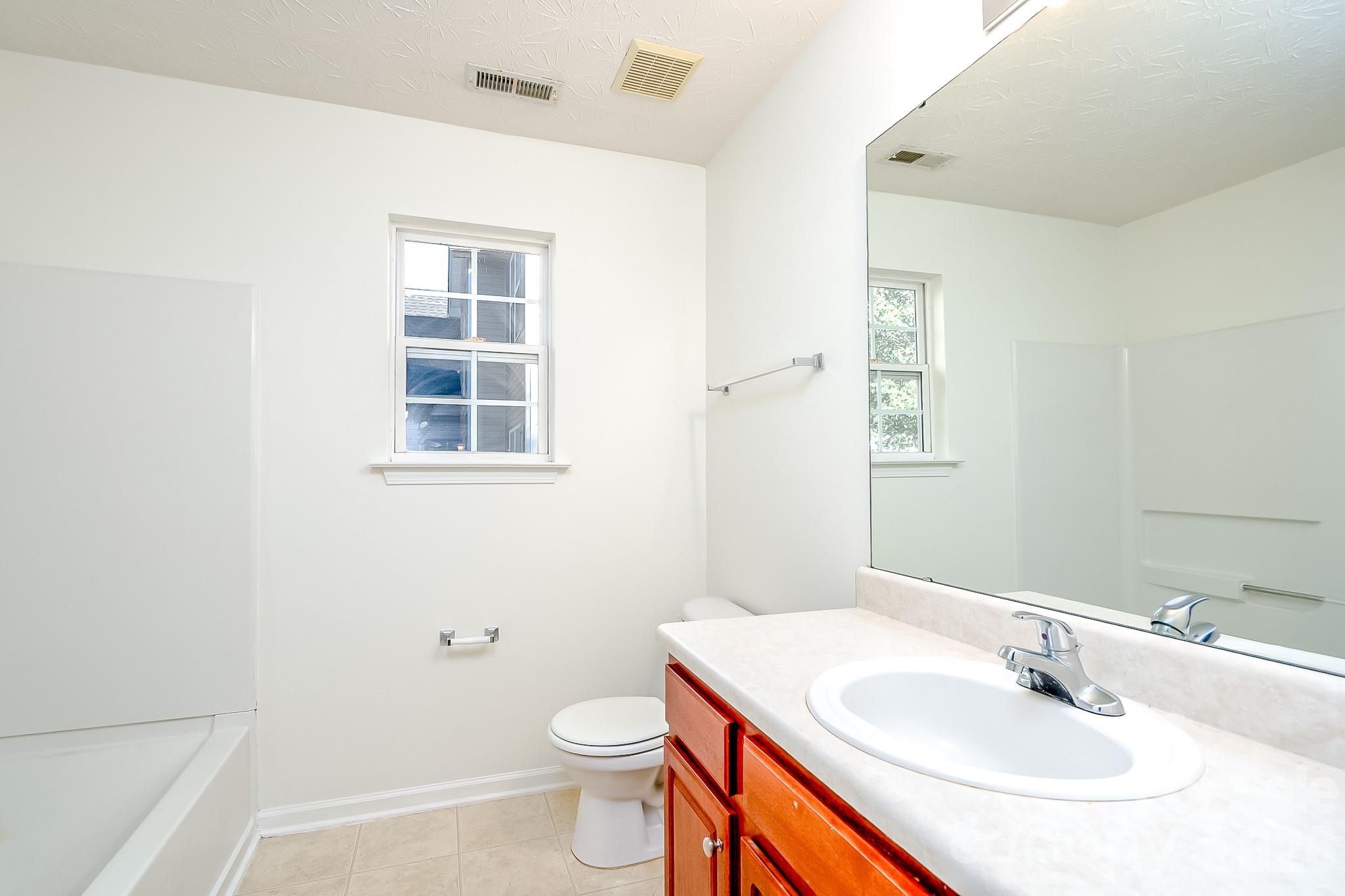 Primary bathroom with garden tub and separate shower - 5124 Eagle Creek Drive, Charlotte