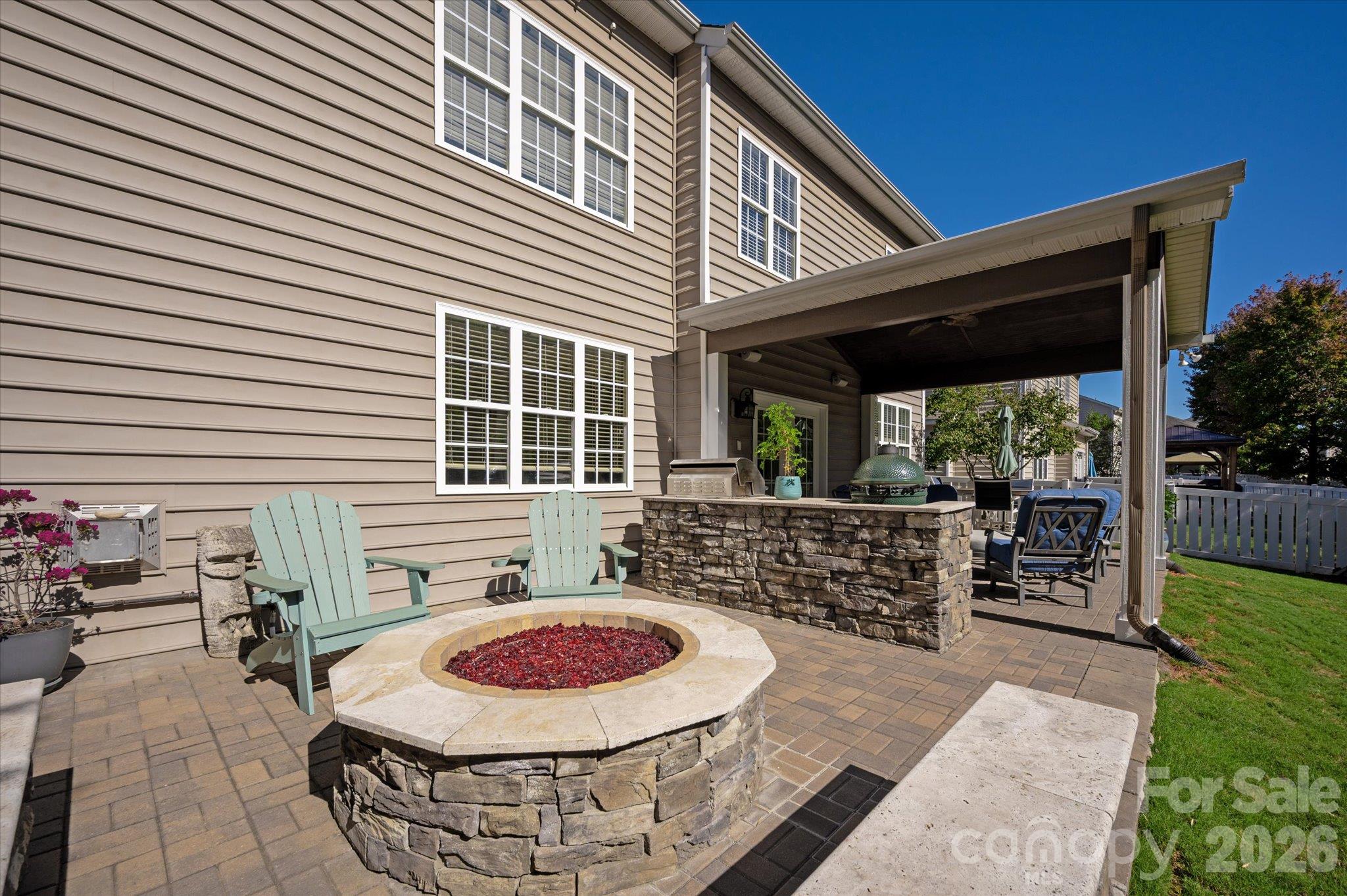 Gas fire pit with hand laid pavers and stone wall - 6107 Cactus Valley Road, Charlotte
