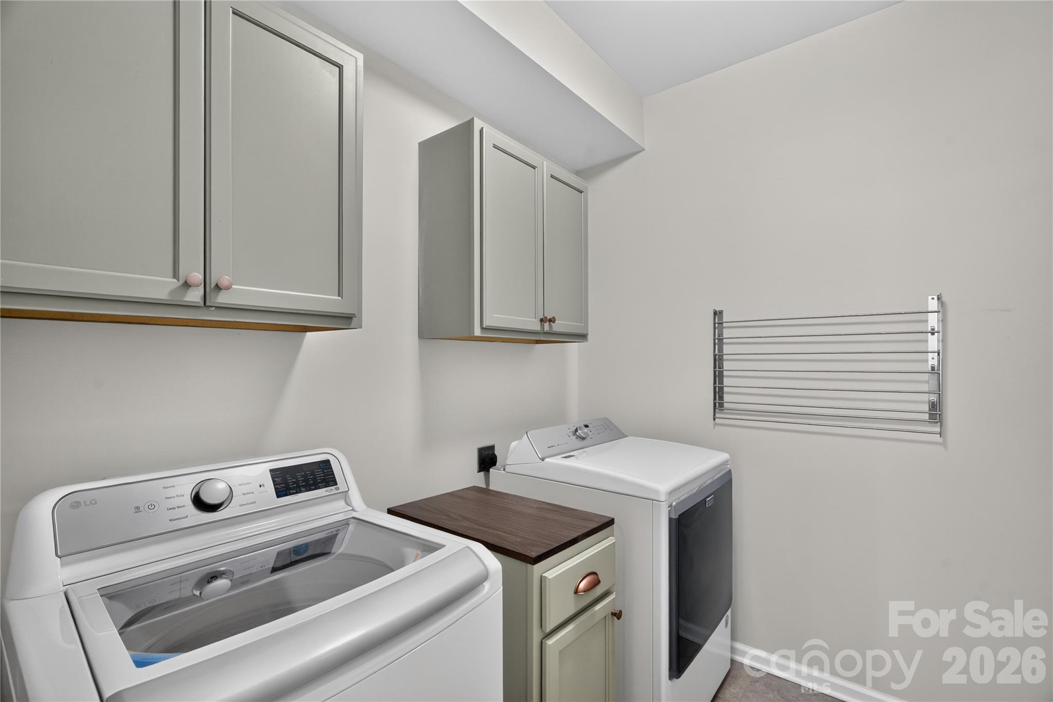 Laundry room on main with gorgeous cabinetry. - 16815 Lookout Landing Lane, Charlotte