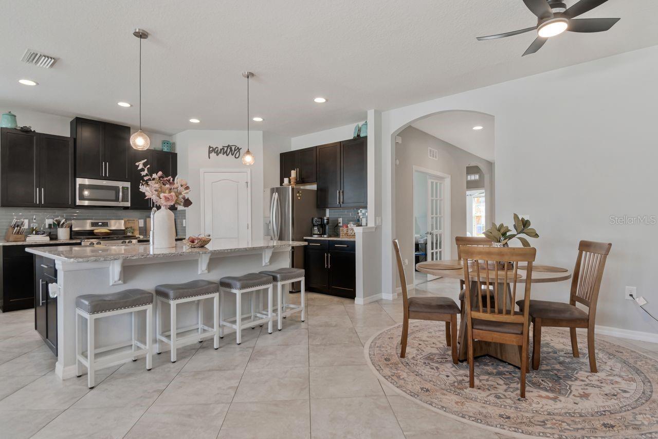 Open concept kitchen with plenty of counter seating availability, large countertop perfect for entertaining. - 11143 SPRING POINT CIR, RIVERVIEW