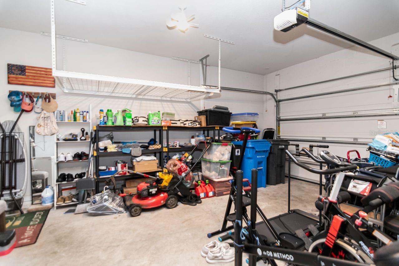 Enclosed Garage with 2 hanging storage racks - 11143 SPRING POINT CIR, RIVERVIEW