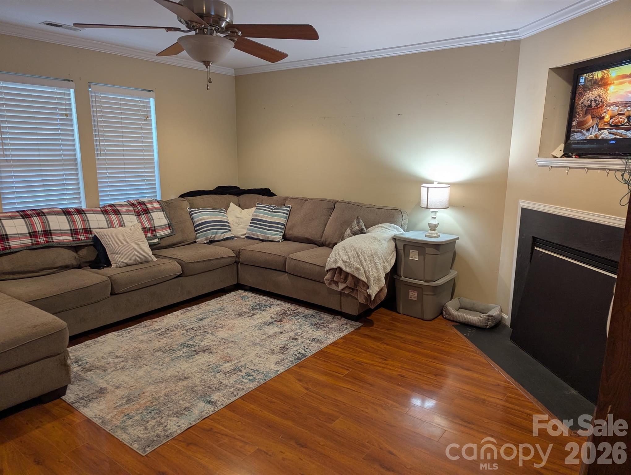 Spacious living room with sectional seating and fireplace - 2320 Chantilly Court, Kannapolis