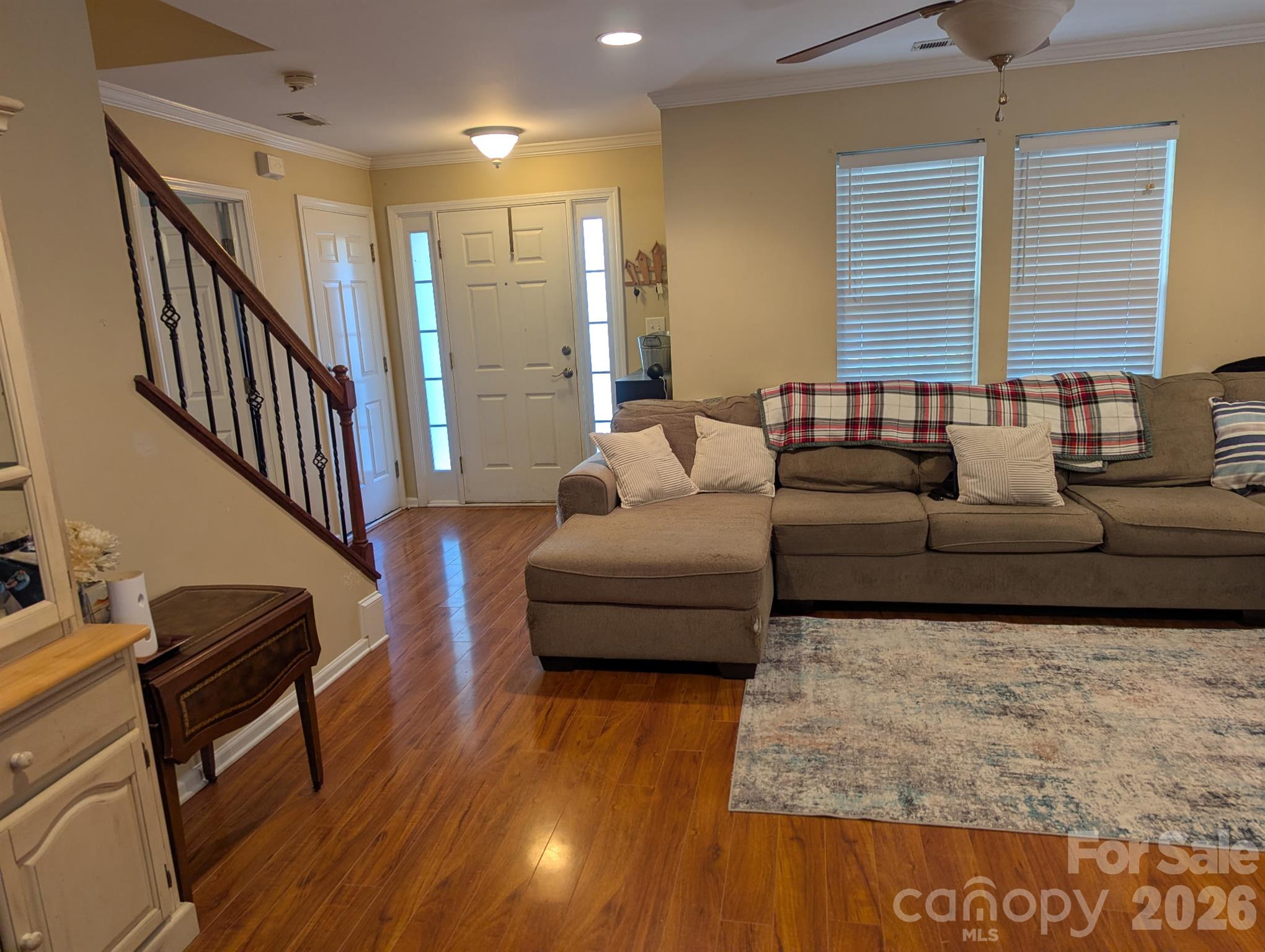 Open living area flows to the staircase and front entry - 2320 Chantilly Court, Kannapolis