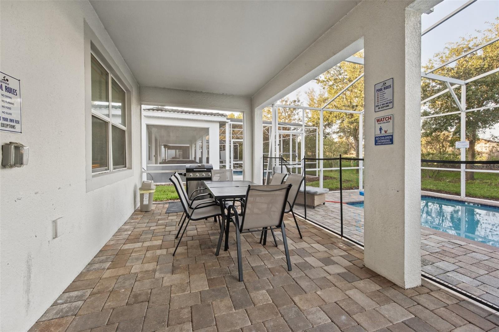 Covered lanai dining - 1540 MAIDSTONE CT, DAVENPORT