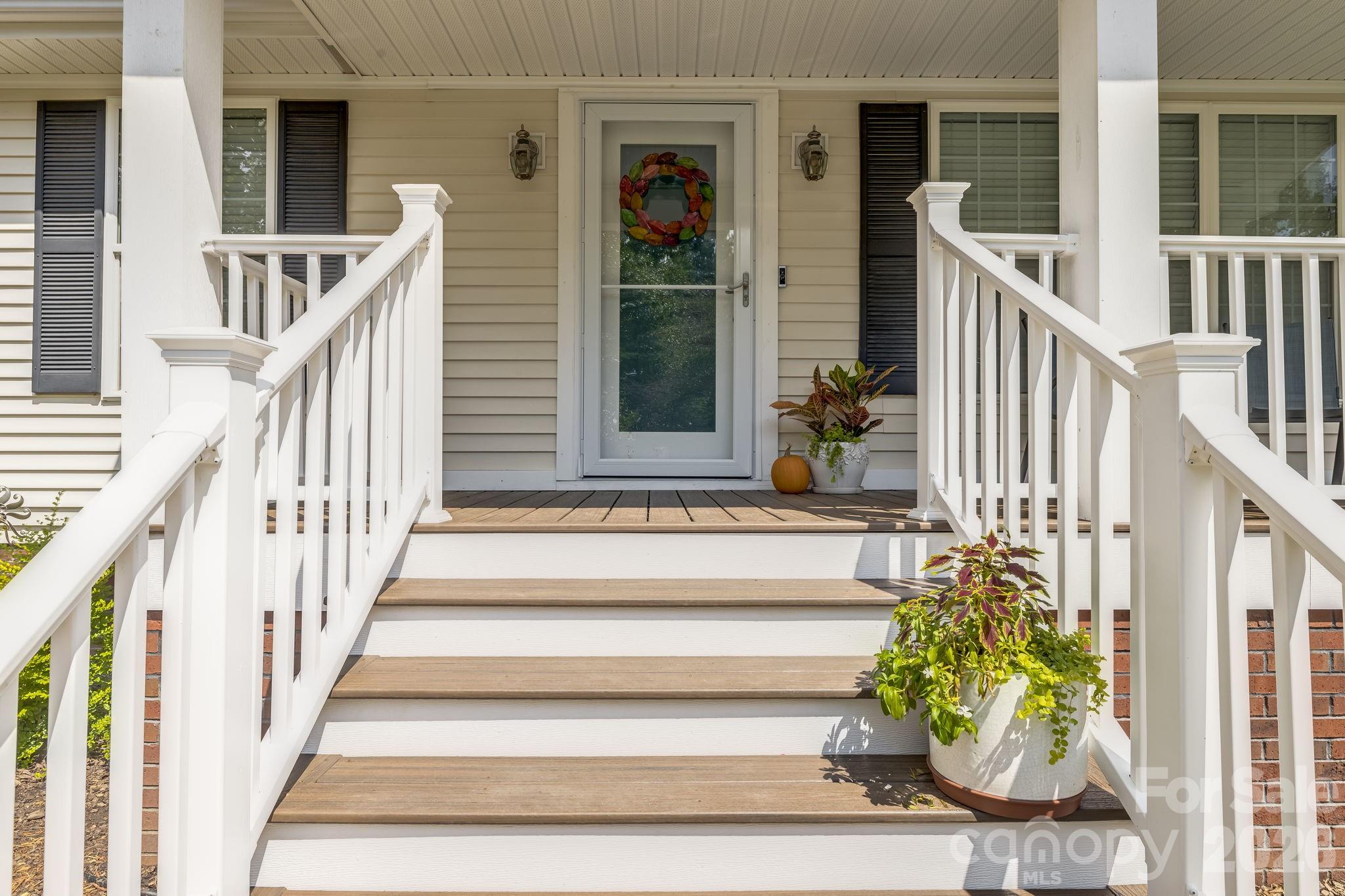 Head up the steps to the brand-new covered Trex porch—your spot to slow down and stay awhile. - 710 Stoney Mountain Road, Hendersonville