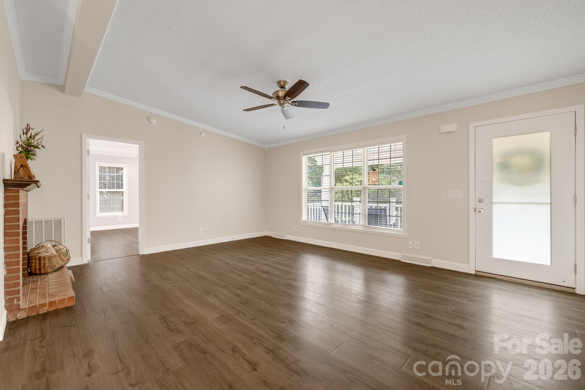 A welcoming living room to gather at the end of the day. - 710 Stoney Mountain Road, Hendersonville