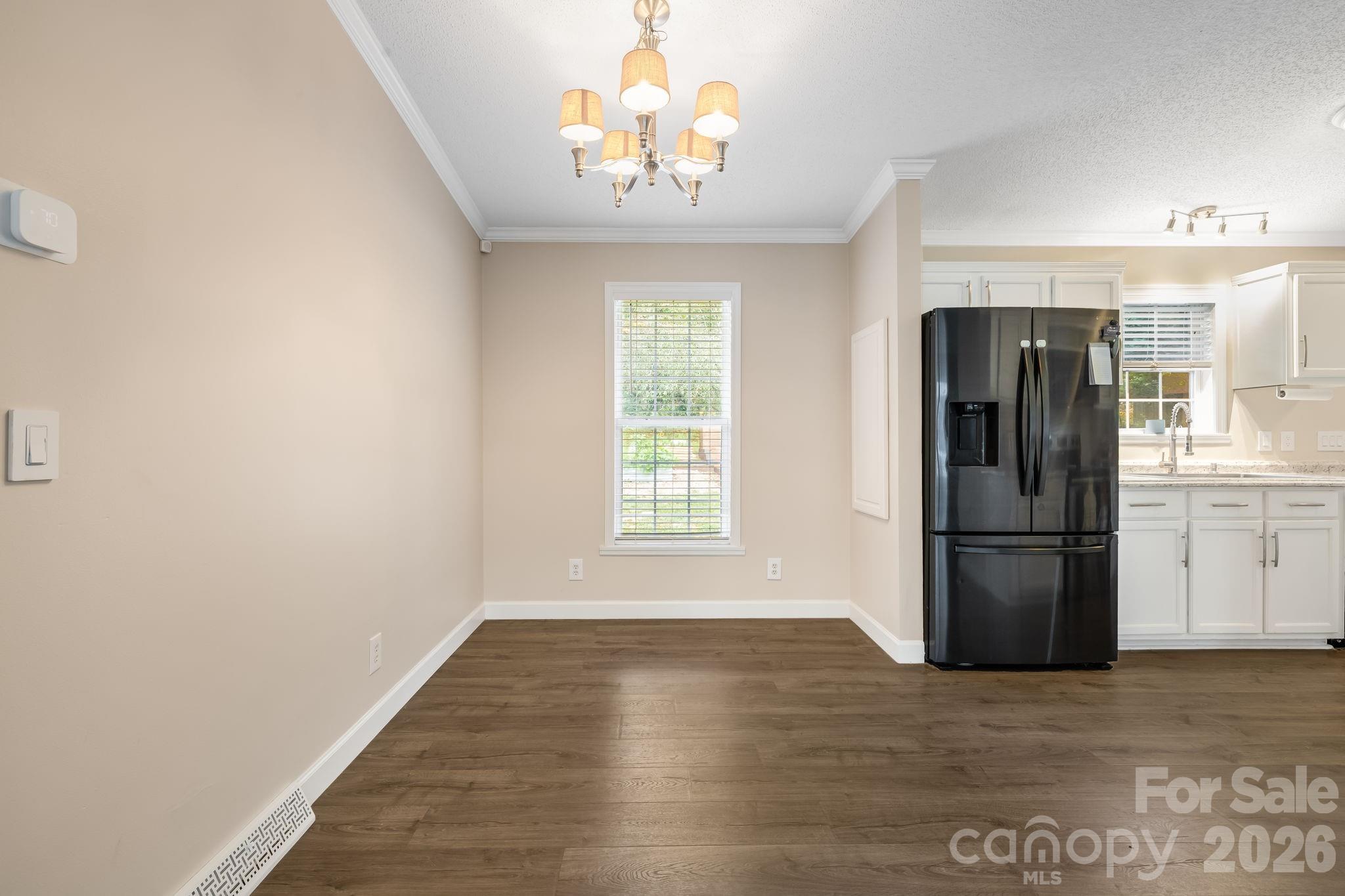 Pull up a chair in the dining area and enjoy a meal together. - 710 Stoney Mountain Road, Hendersonville