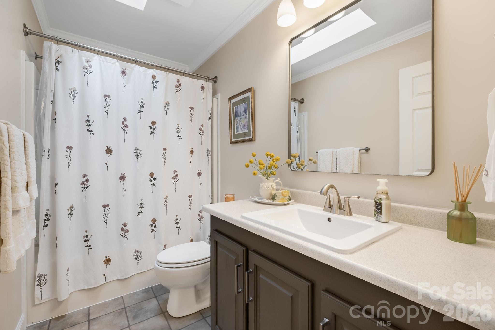 An updated bath convenient to the secondary bedrooms. - 710 Stoney Mountain Road, Hendersonville