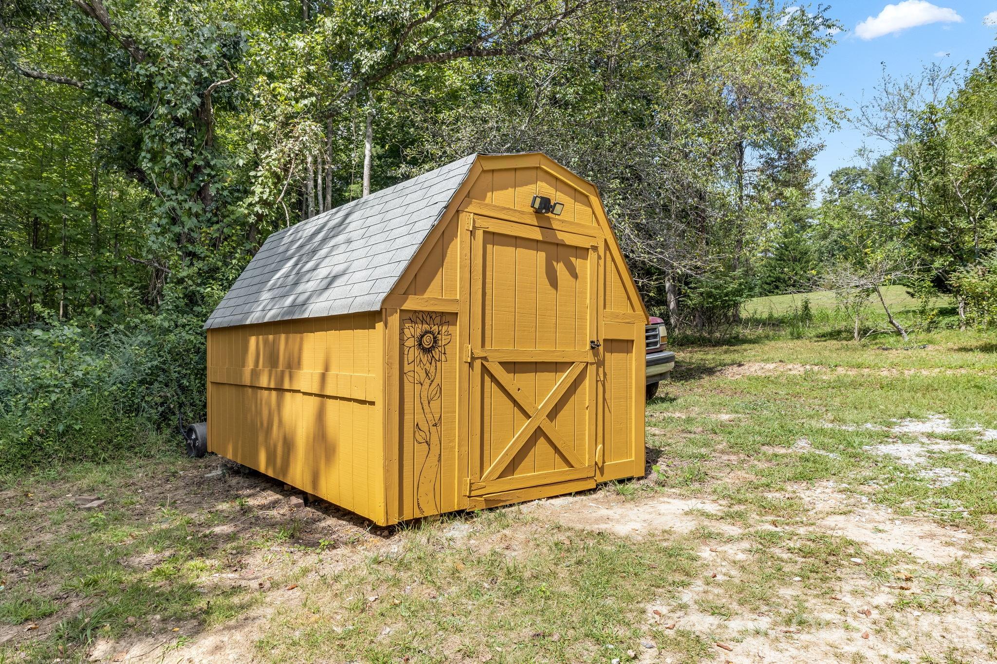 Keep your garden tools and outdoor gear close by in the shed. - 710 Stoney Mountain Road, Hendersonville