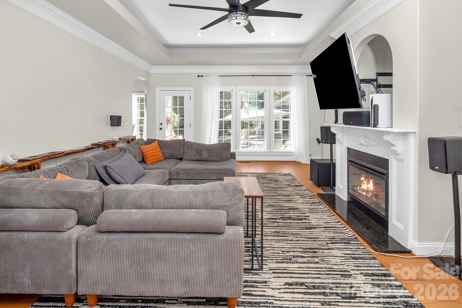 Family Room (Fireplace is virtually staged) - 5050 Shady Meadow Lane, Denver