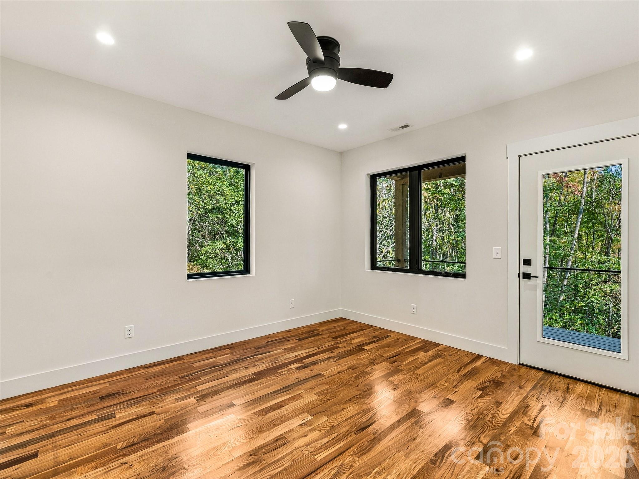 Primary Bedroom with private exit to back porch - 384 Green Hollow Lane, Brevard