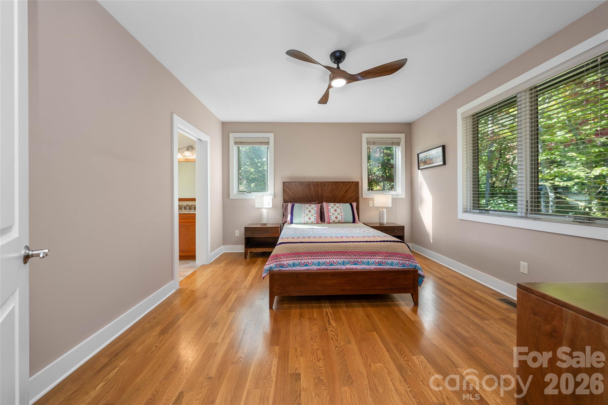 Primary bedroom suite on the main level. - 351 Chapel Road, Black Mountain
