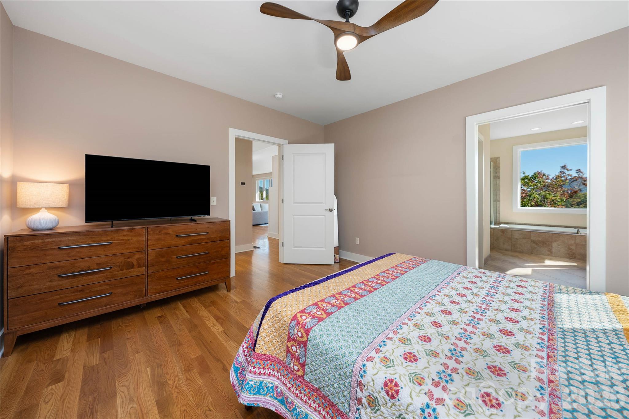 Primary bedroom suite on the main level. - 351 Chapel Road, Black Mountain