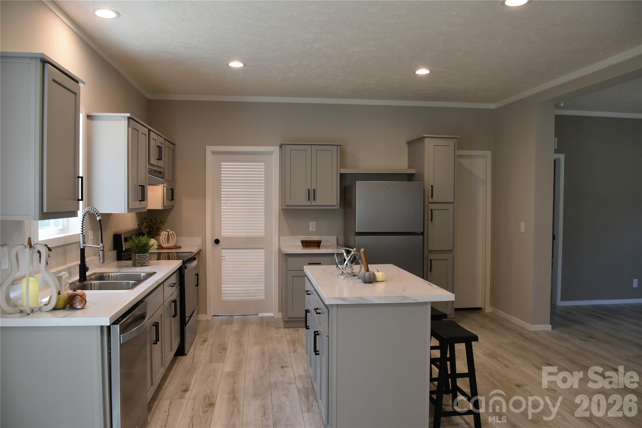 large kitchen island with lots of cabinets for storage - 105 Cottontail Lane, Statesville