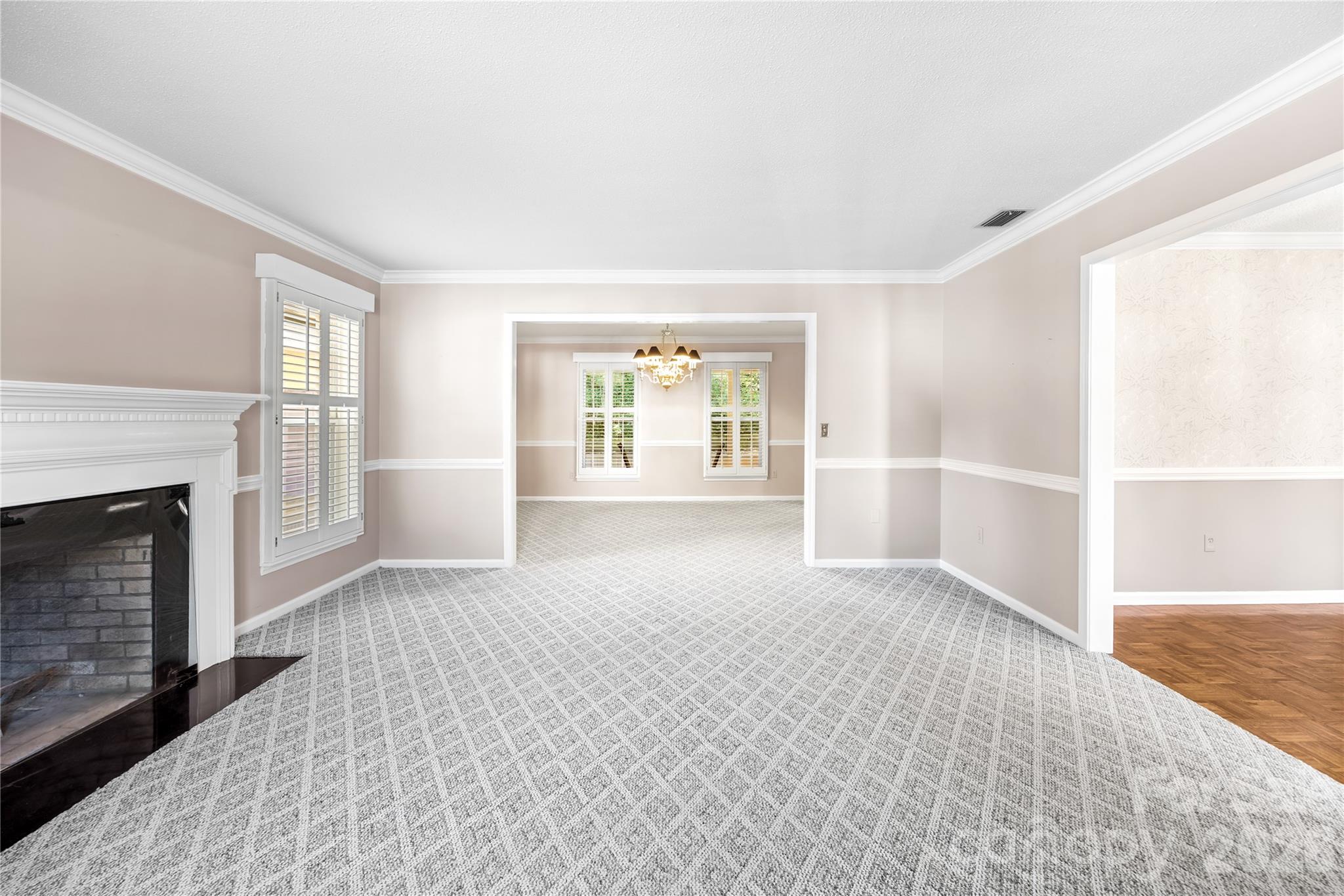 Living Room and Full view into additional living space. - 477 Birchwood Trail NE, Concord
