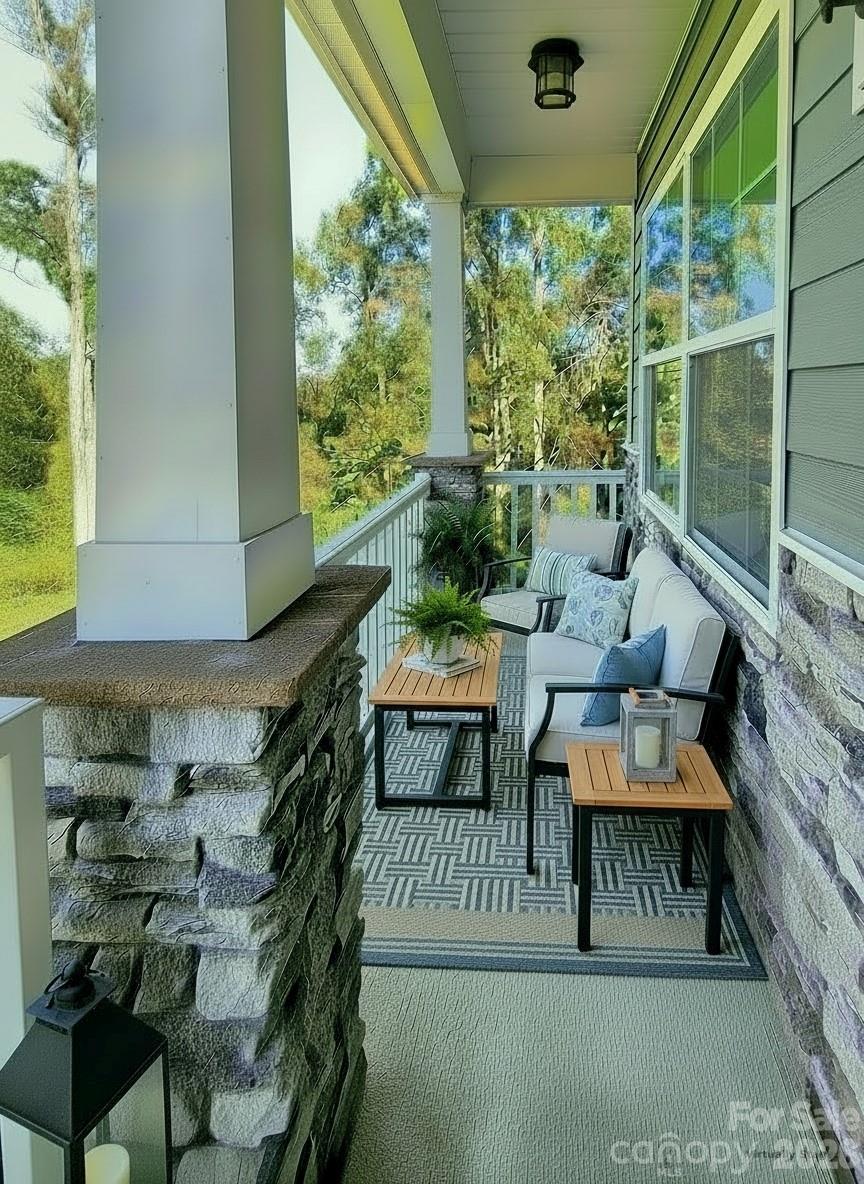 Front porch with vinyl handrails and spindles. - 3741 Stanley Creek Drive, Mount Holly