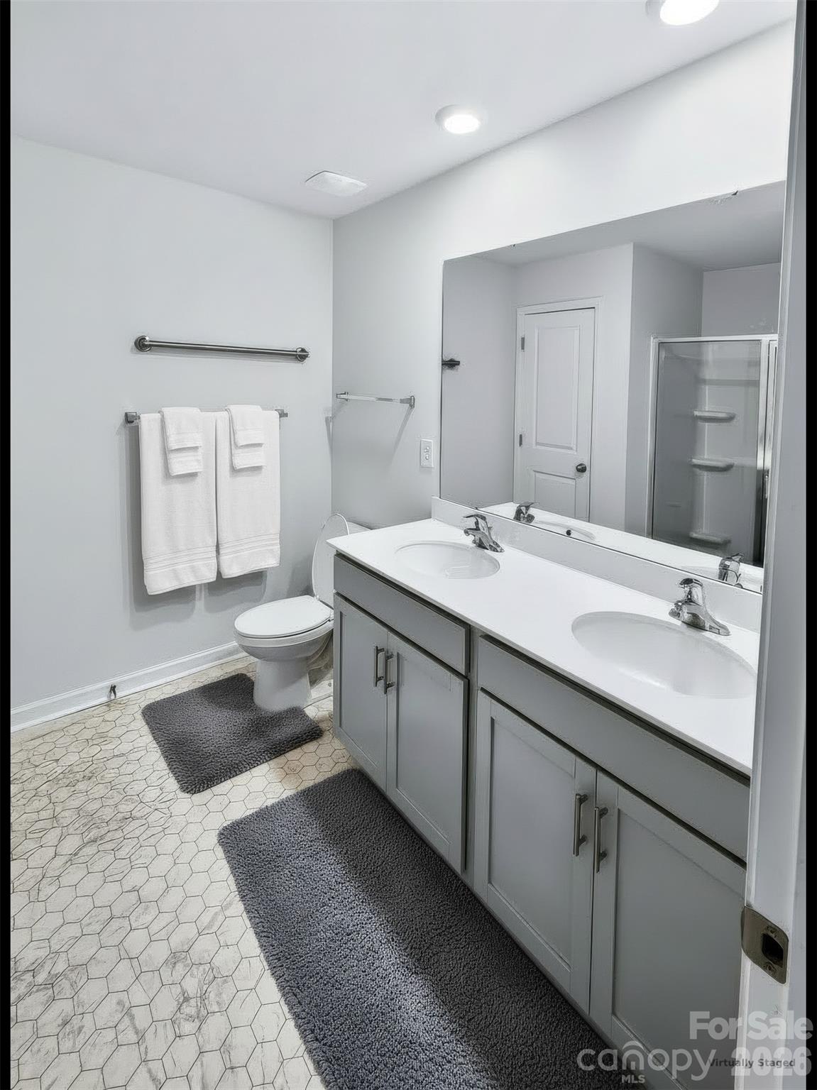 Large primary bath with dual vanities and linen closet. - 3741 Stanley Creek Drive, Mount Holly