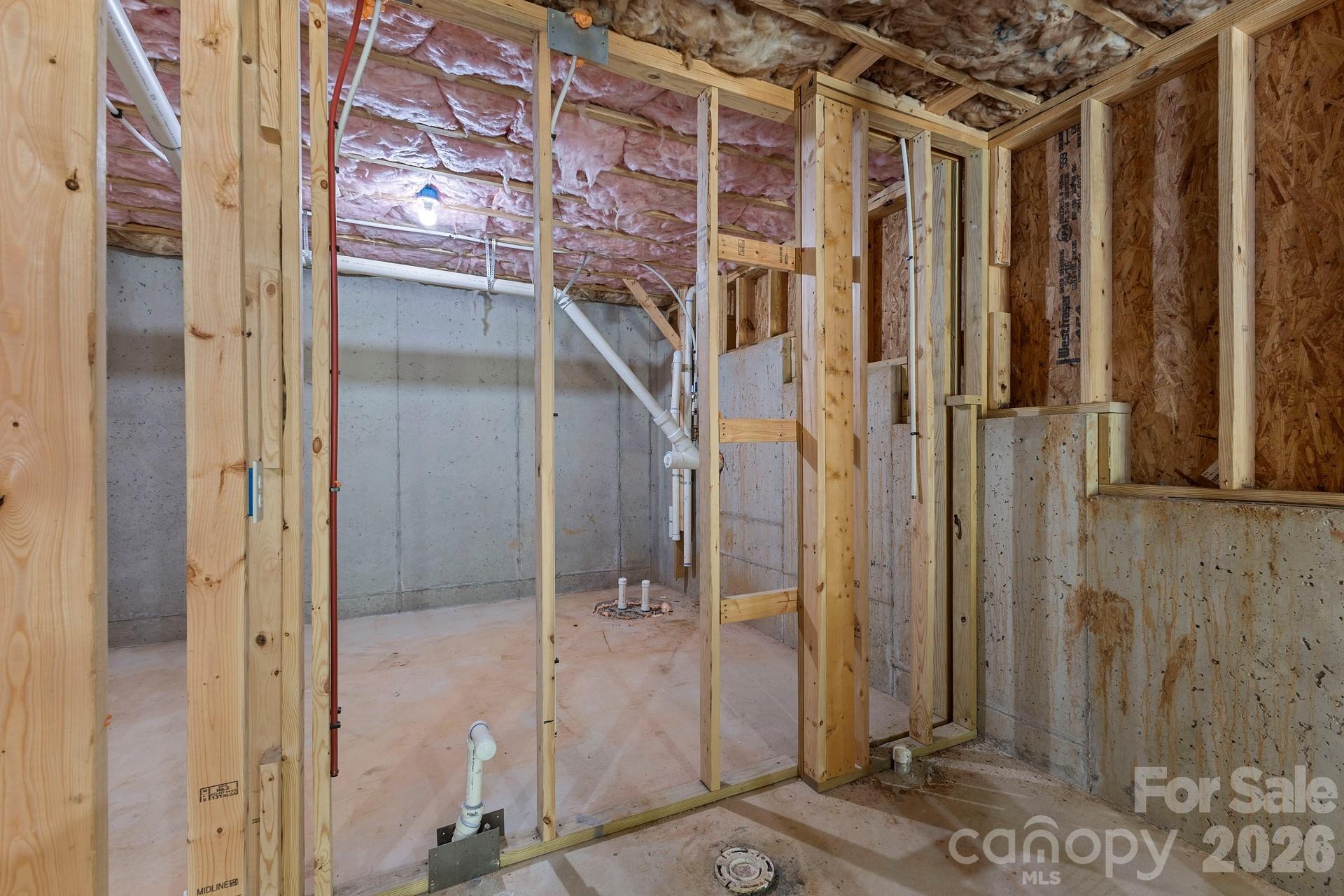 Framed unfinished full bath located in the basement. Rough in plumbing for future bath. - 3741 Stanley Creek Drive, Mount Holly