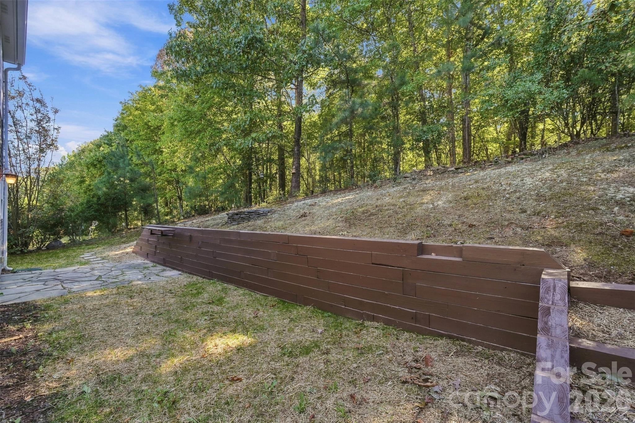 Retaining wall with grilling ledge. - 1901 Beckwith Lane, Waxhaw