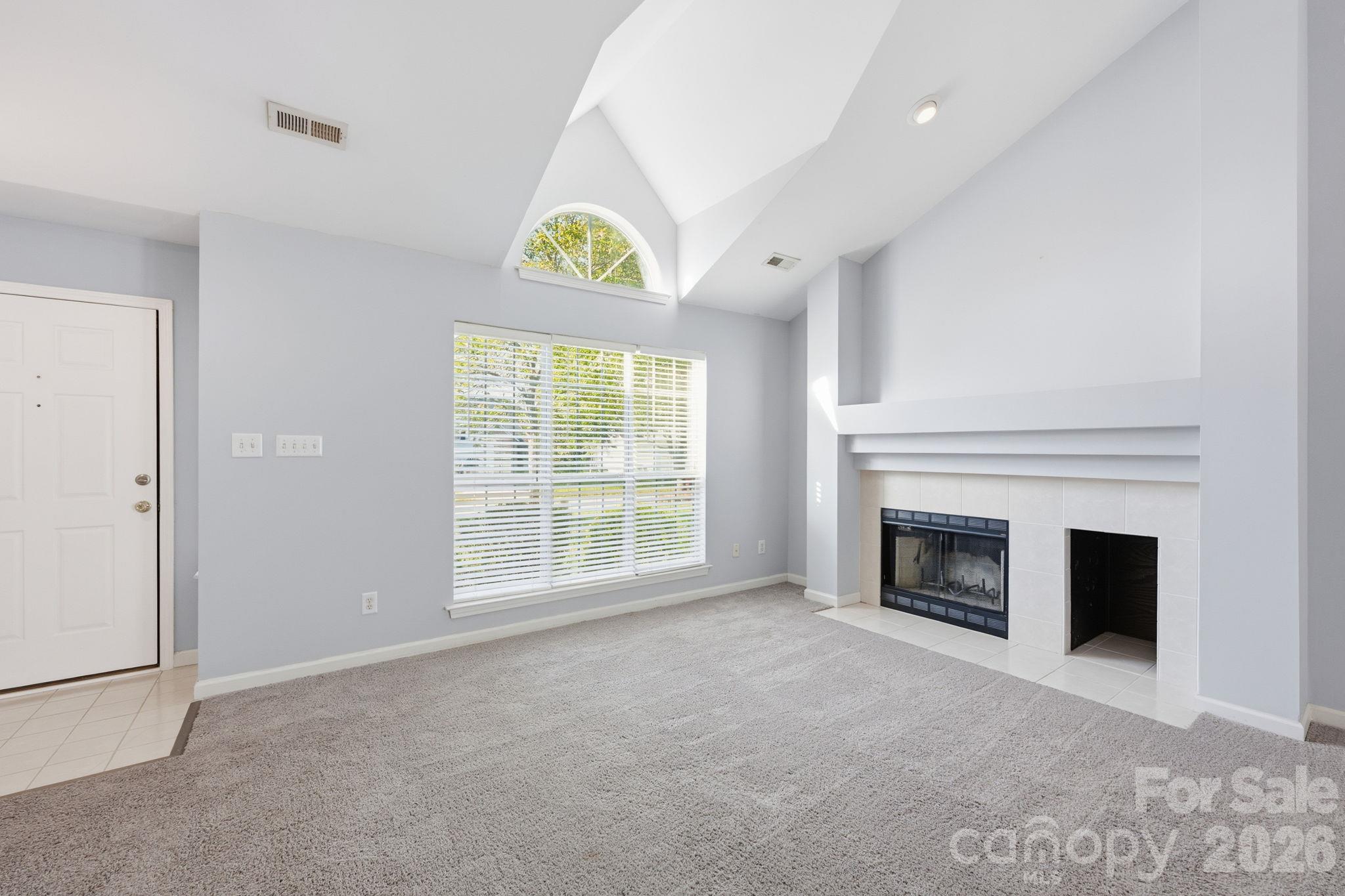 Enter, and take in the open floor plan and beautiful Living Room with its vaulted ceiling! - 4000 Huntmeadow Drive, Charlotte