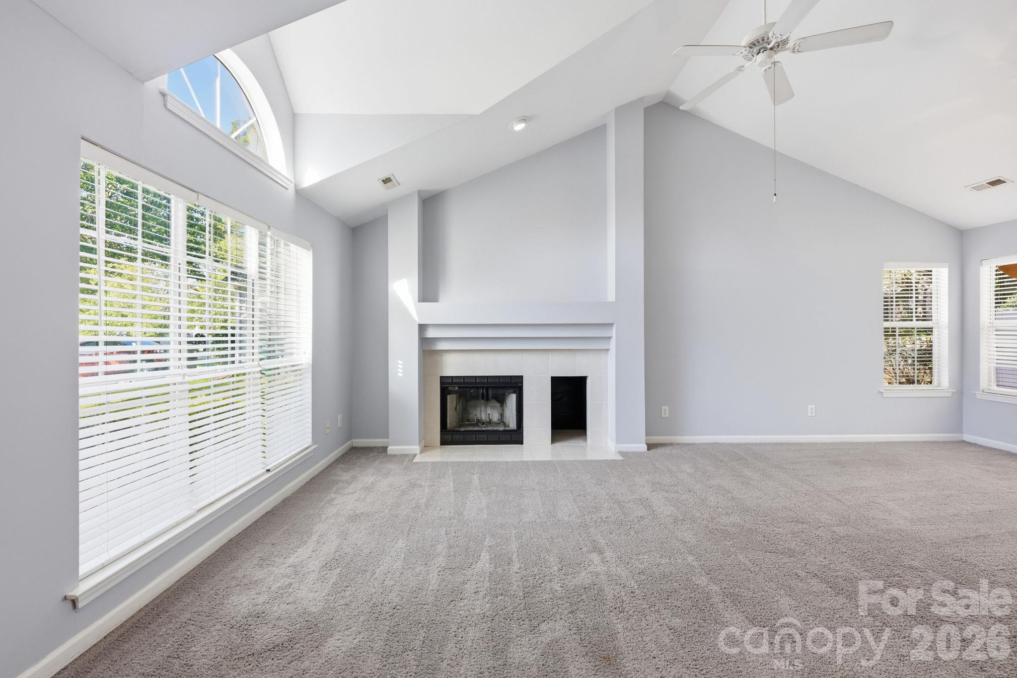 Another view of the Living Room with its wood-burning fireplace! - 4000 Huntmeadow Drive, Charlotte
