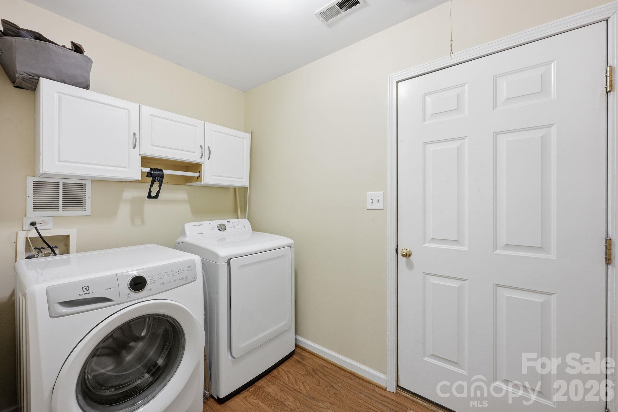 This is the Laundry Room AND the Washer and Dryer convey. Both are only 6 years old! - 4000 Huntmeadow Drive, Charlotte
