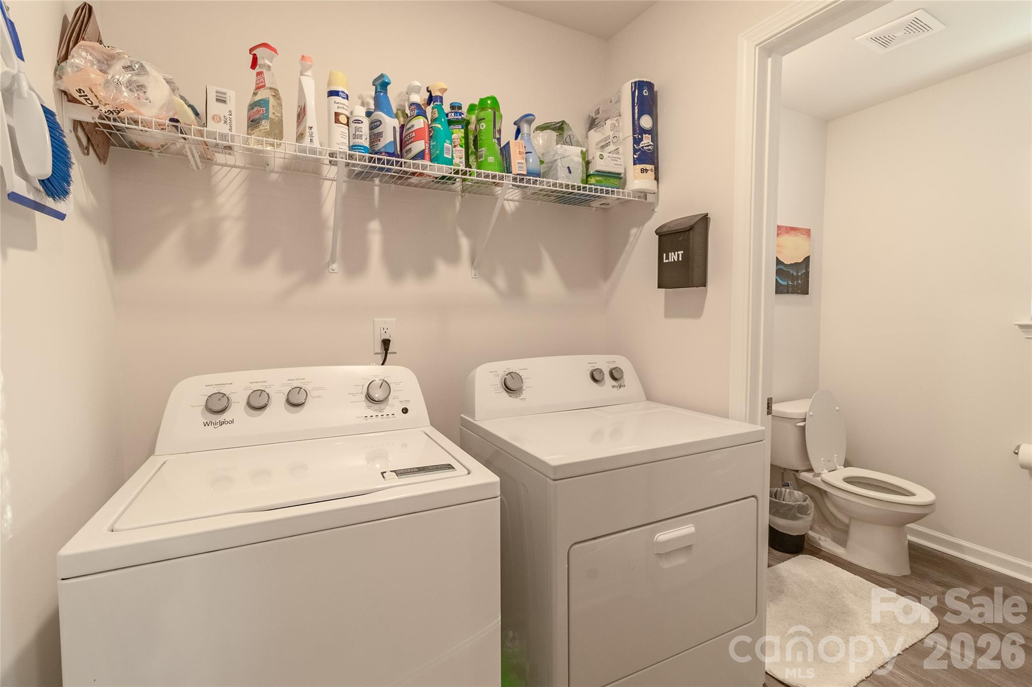 Laundry room with adjacent 1/2 bath. - 34 Cain Hollow Way, Asheville