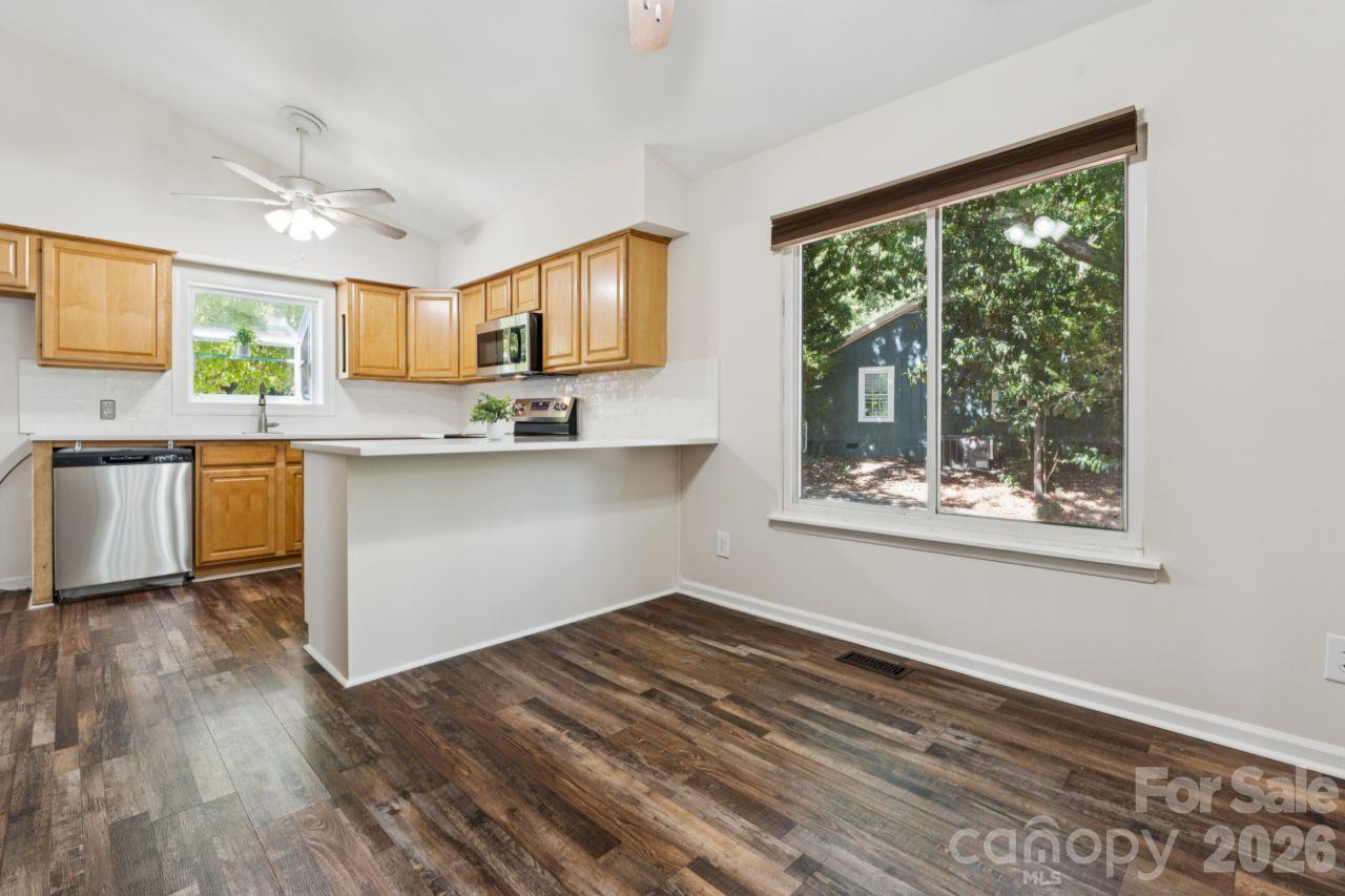 Dining area into kitchen - 3106 Point Clear Drive, Tega Cay