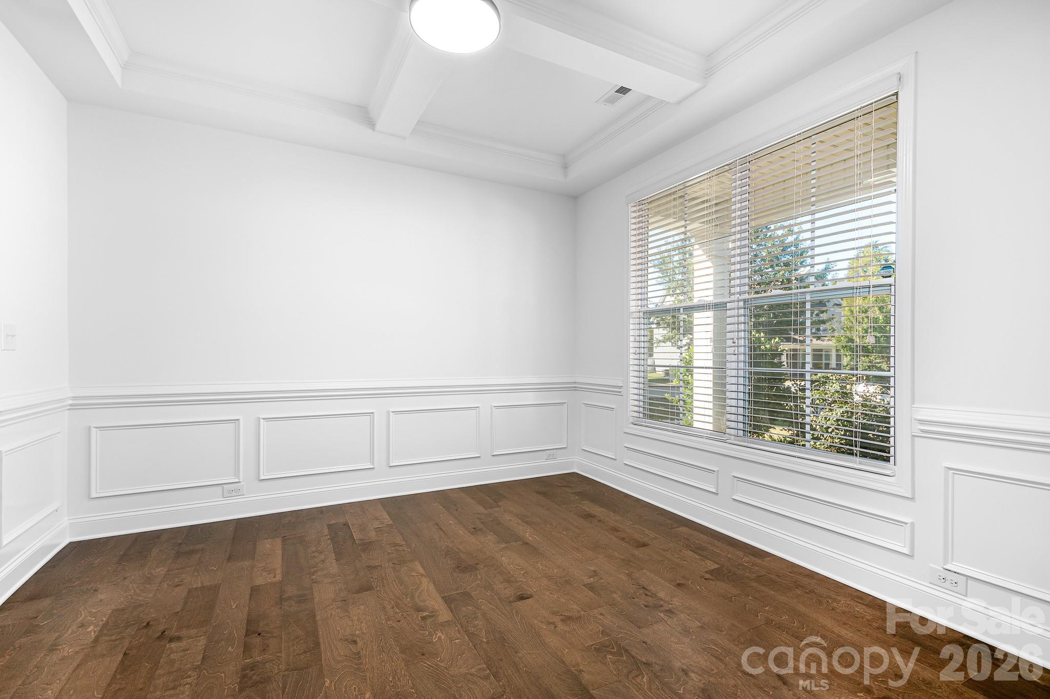 The dining room has a gorgeous coffered ceiling, wainscoting, large windows and new lighting. - 3967 Lake Breeze Drive, Sherrills Ford