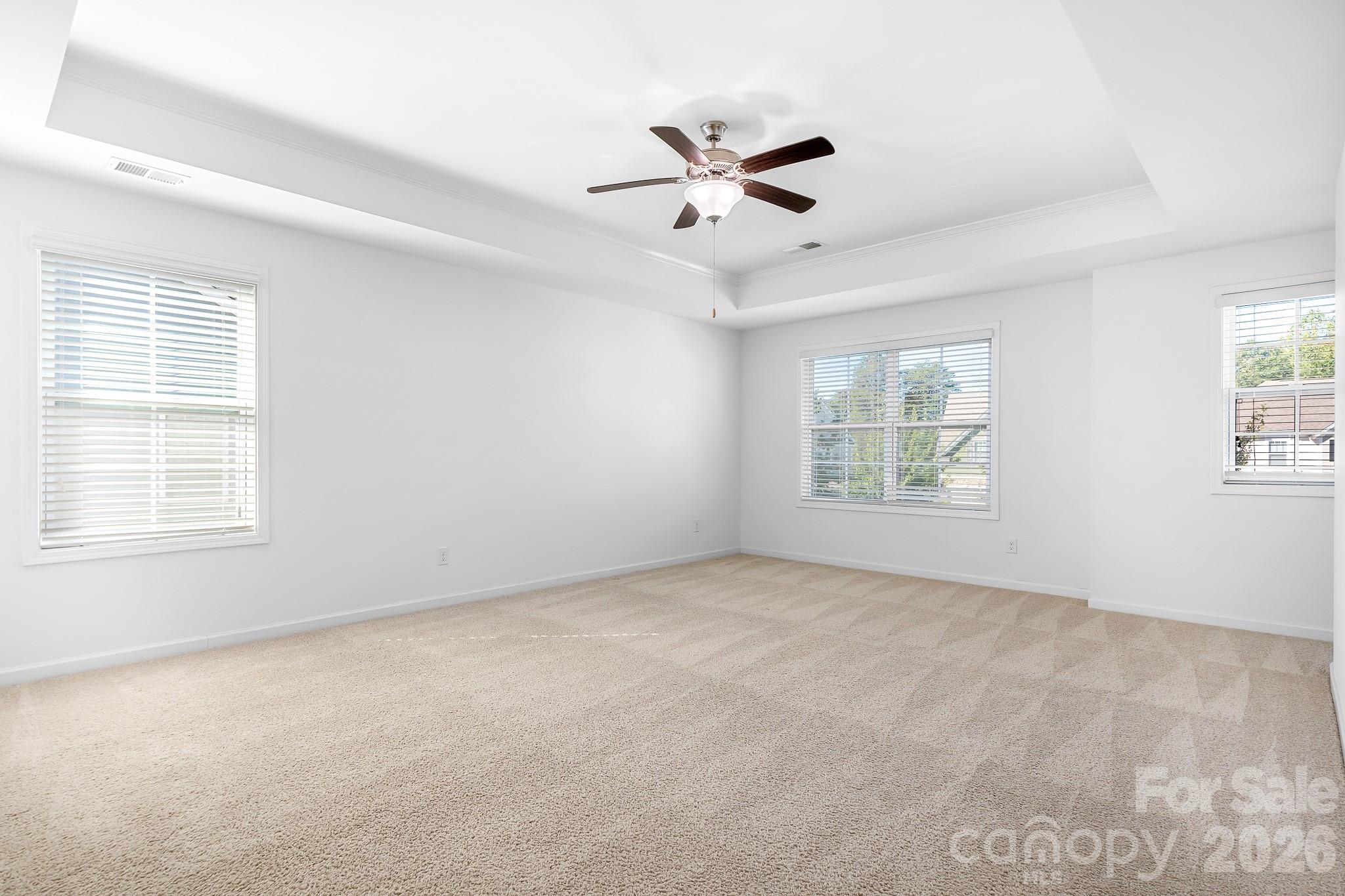 The upstairs primary suite is a true retreat, with generous proportions, beautiful natural light, and plenty of room to relax and unwind. - 3967 Lake Breeze Drive, Sherrills Ford