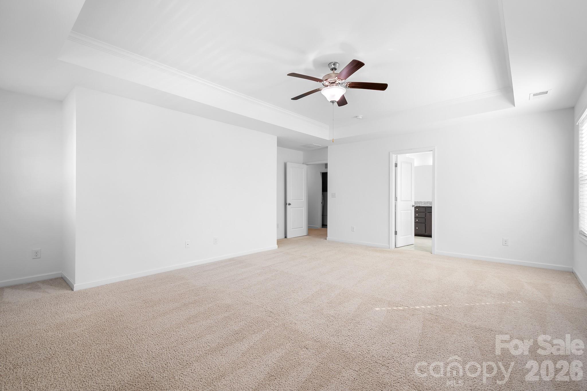 Spacious primary suite with fresh white paint and lots of wall space for all your furniture needs. - 3967 Lake Breeze Drive, Sherrills Ford