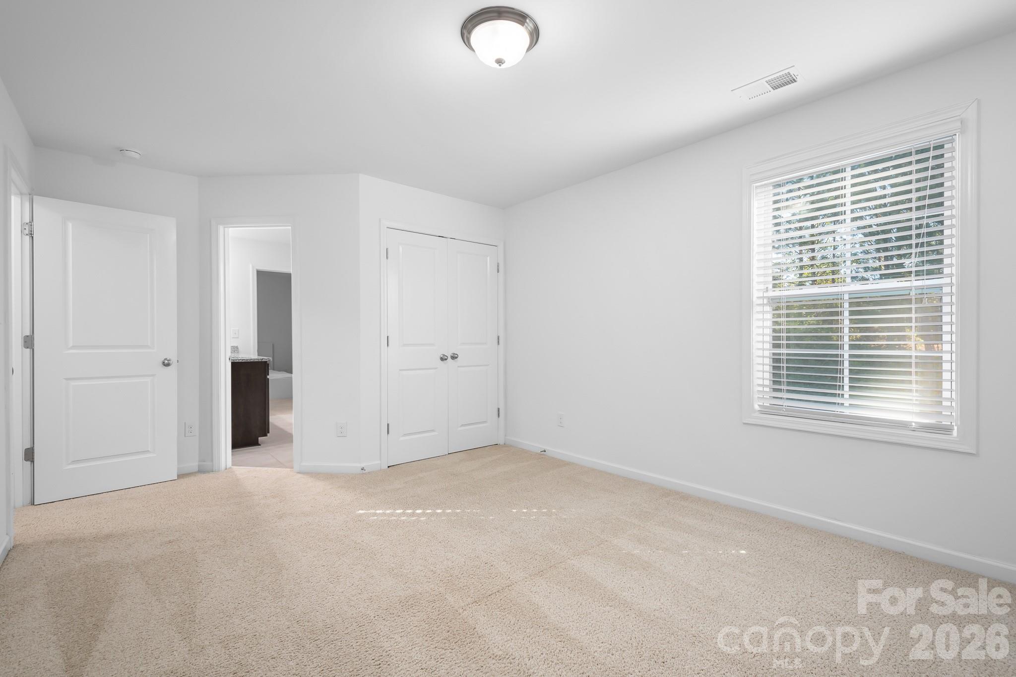 Upper level guest bedroom connects to Jack-and-Jill Bath. - 3967 Lake Breeze Drive, Sherrills Ford