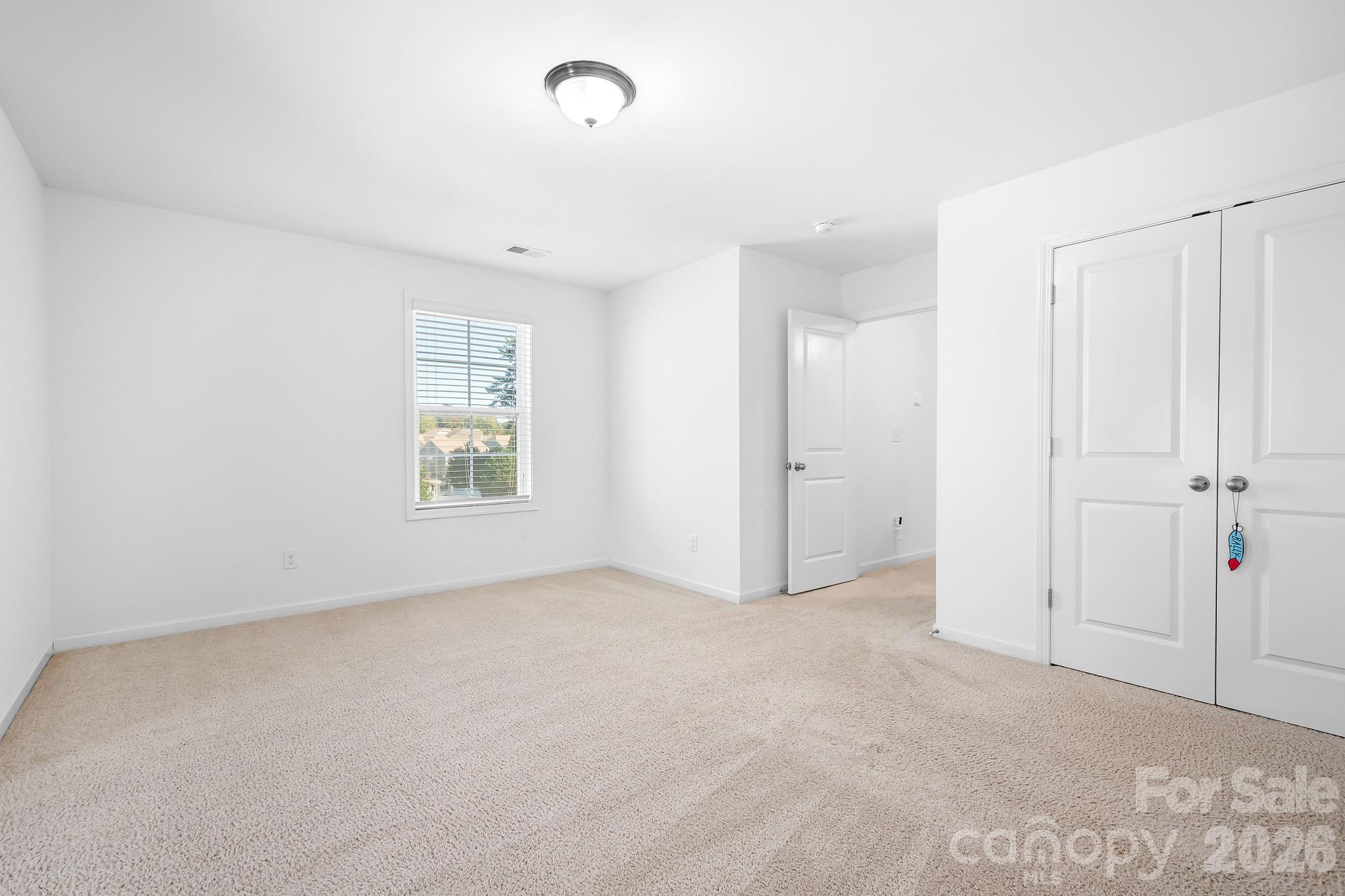 The spacious upper level bedroom/bonus room - perfect for all your needs. - 3967 Lake Breeze Drive, Sherrills Ford