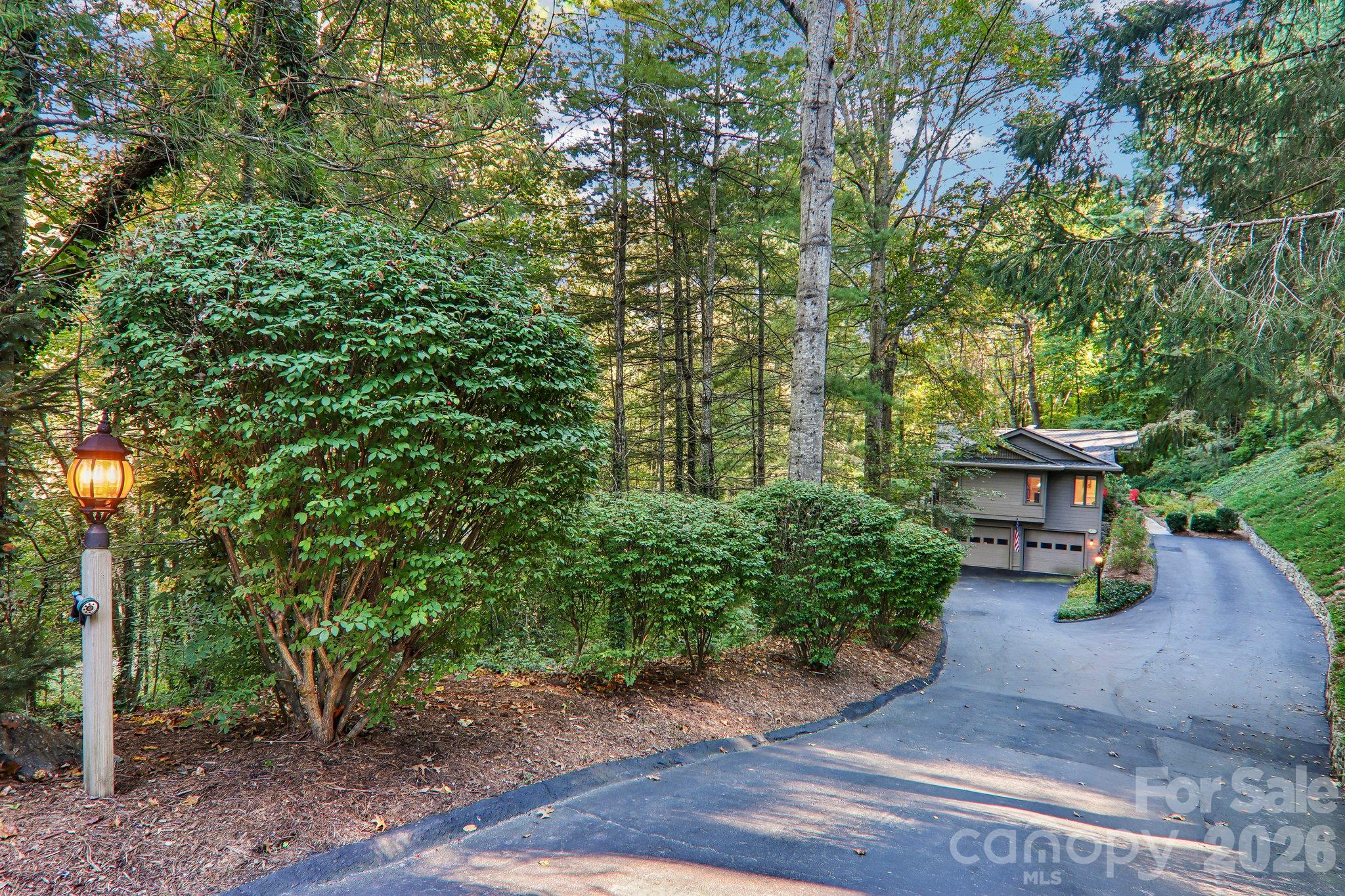 Upper and lower driveway parking for easy entry. - 212 Pheasant Run, Hendersonville