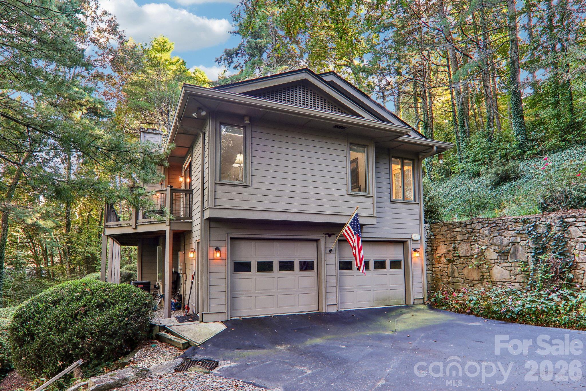 Side of the home with garage entry - 212 Pheasant Run, Hendersonville