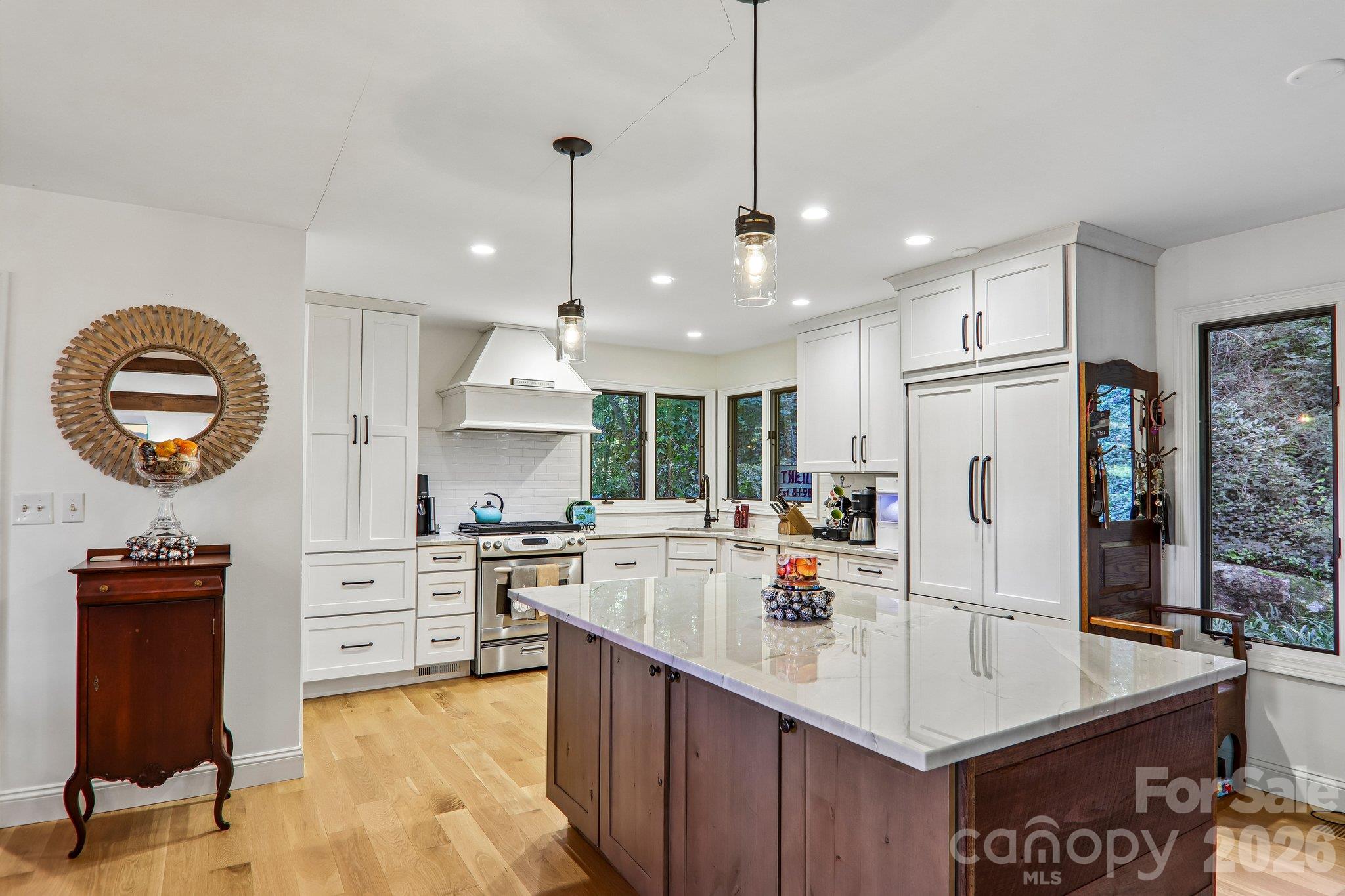 A cooks delight this beautiful kitchen with Quartz counter tops, gas range and Fisher & Paykel refrigerator - 212 Pheasant Run, Hendersonville
